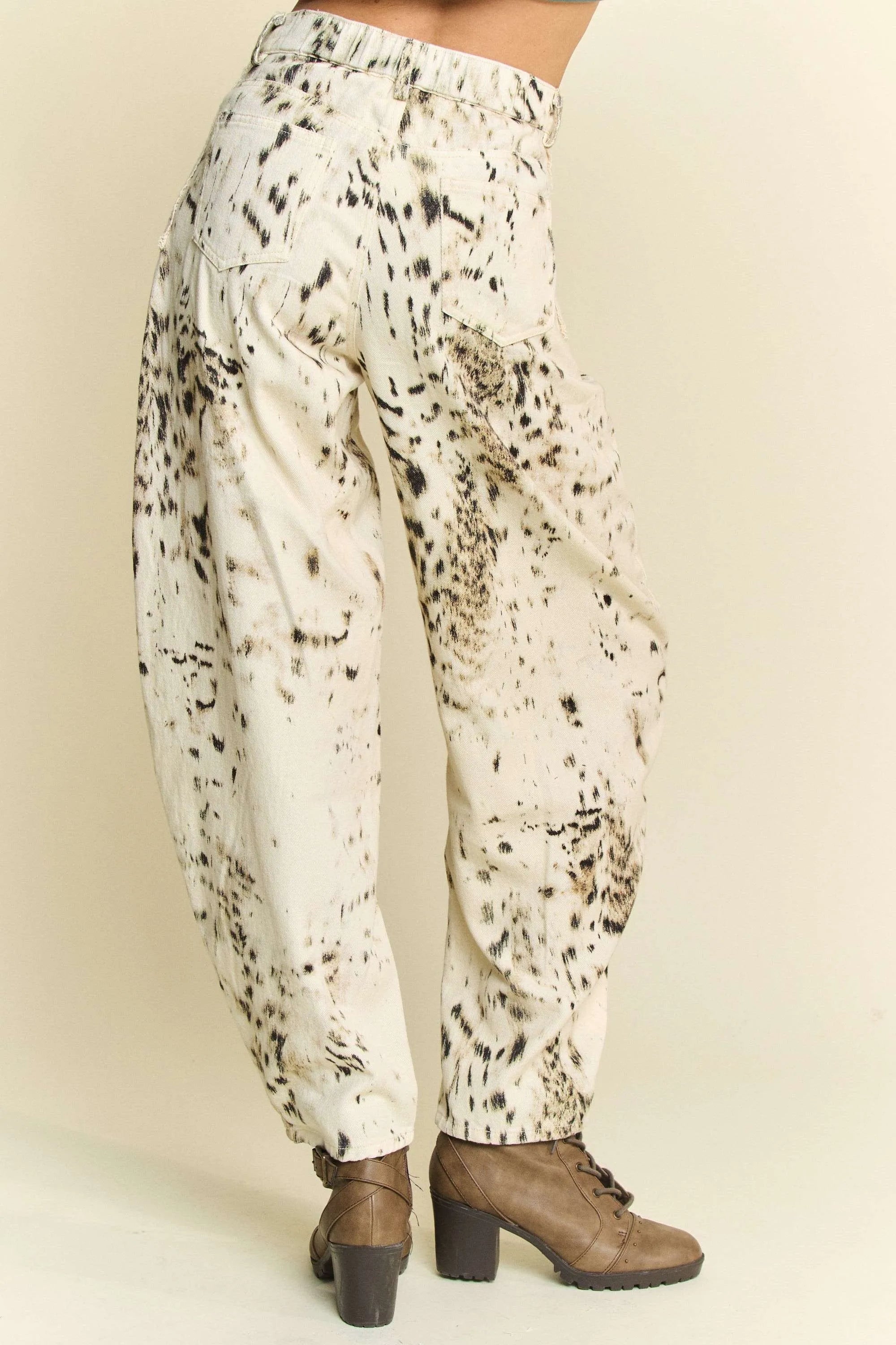 Cream barrel-leg pants with black dot tie-dye print along back panel