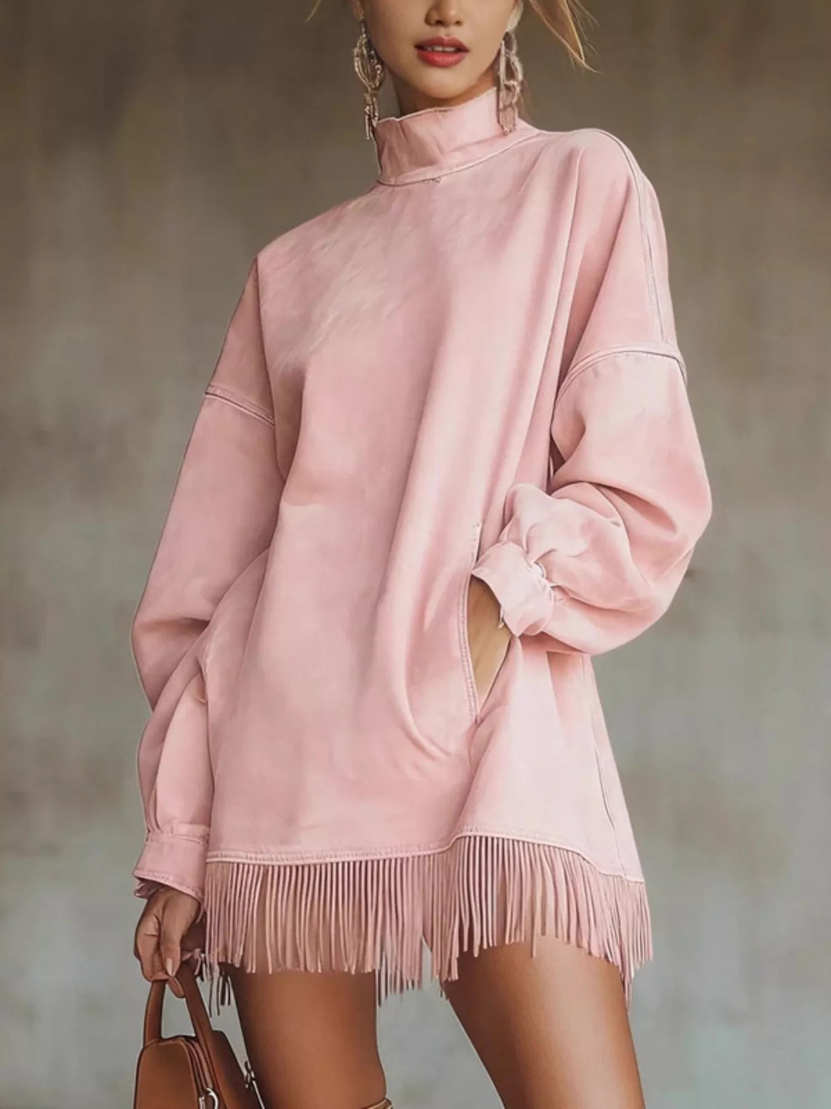 Pink mock neck mini dress with long sleeves and fringe trim at hem