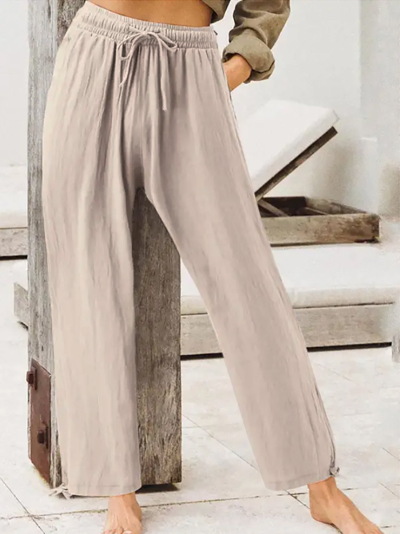 Women's wide-leg drawstring pants in light gray, elastic waist, relaxed fit.