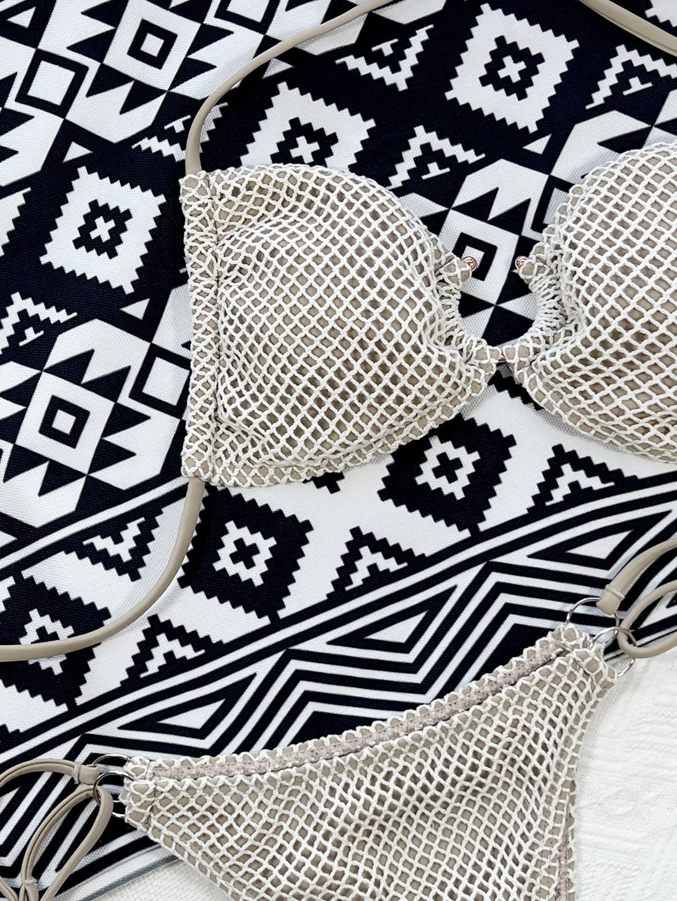Ivory fishnet bikini set close-up: underwire halter top and high-cut bottom