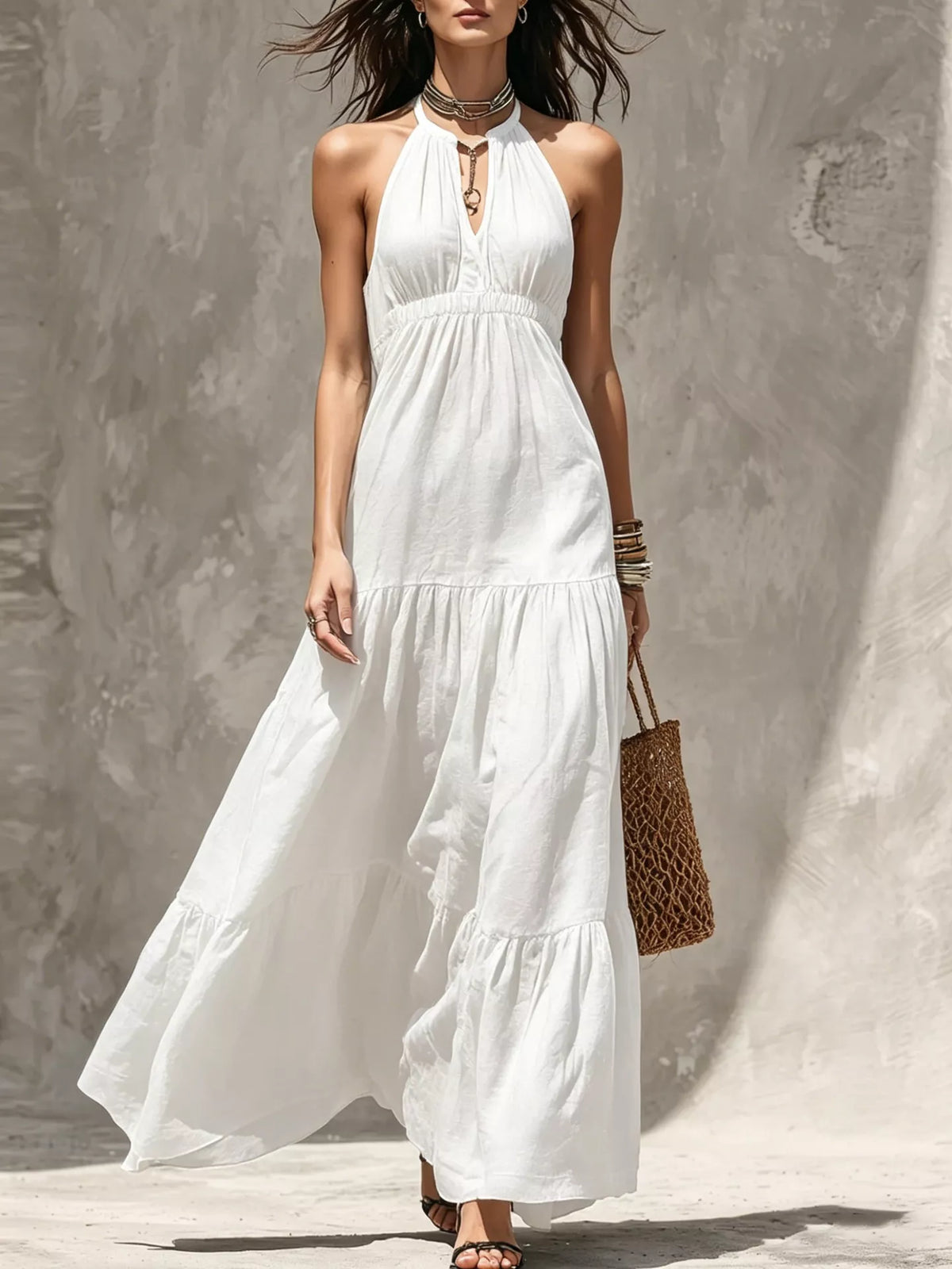 White tiered halter sleeveless maxi dress with smocked waist and flowy tiered skirt