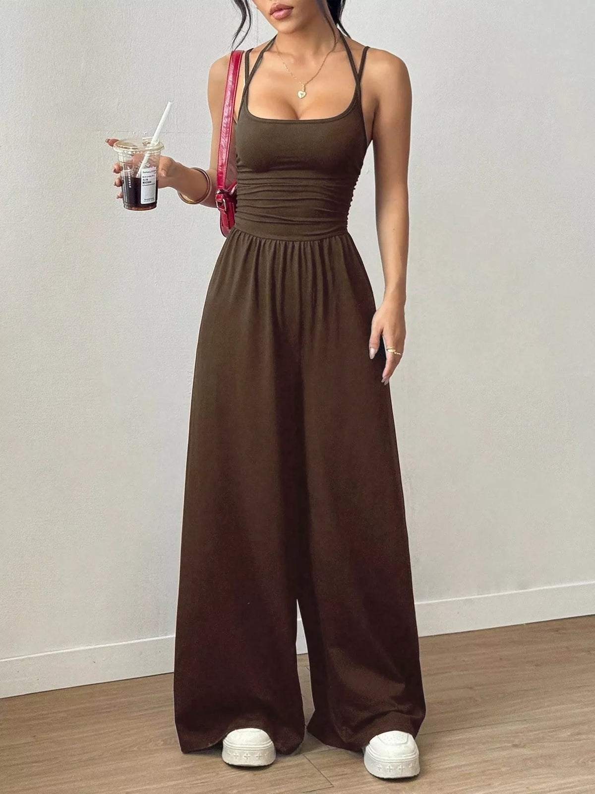 Brown spaghetti-strap wide-leg jumpsuit with ruched bodice and elastic waist