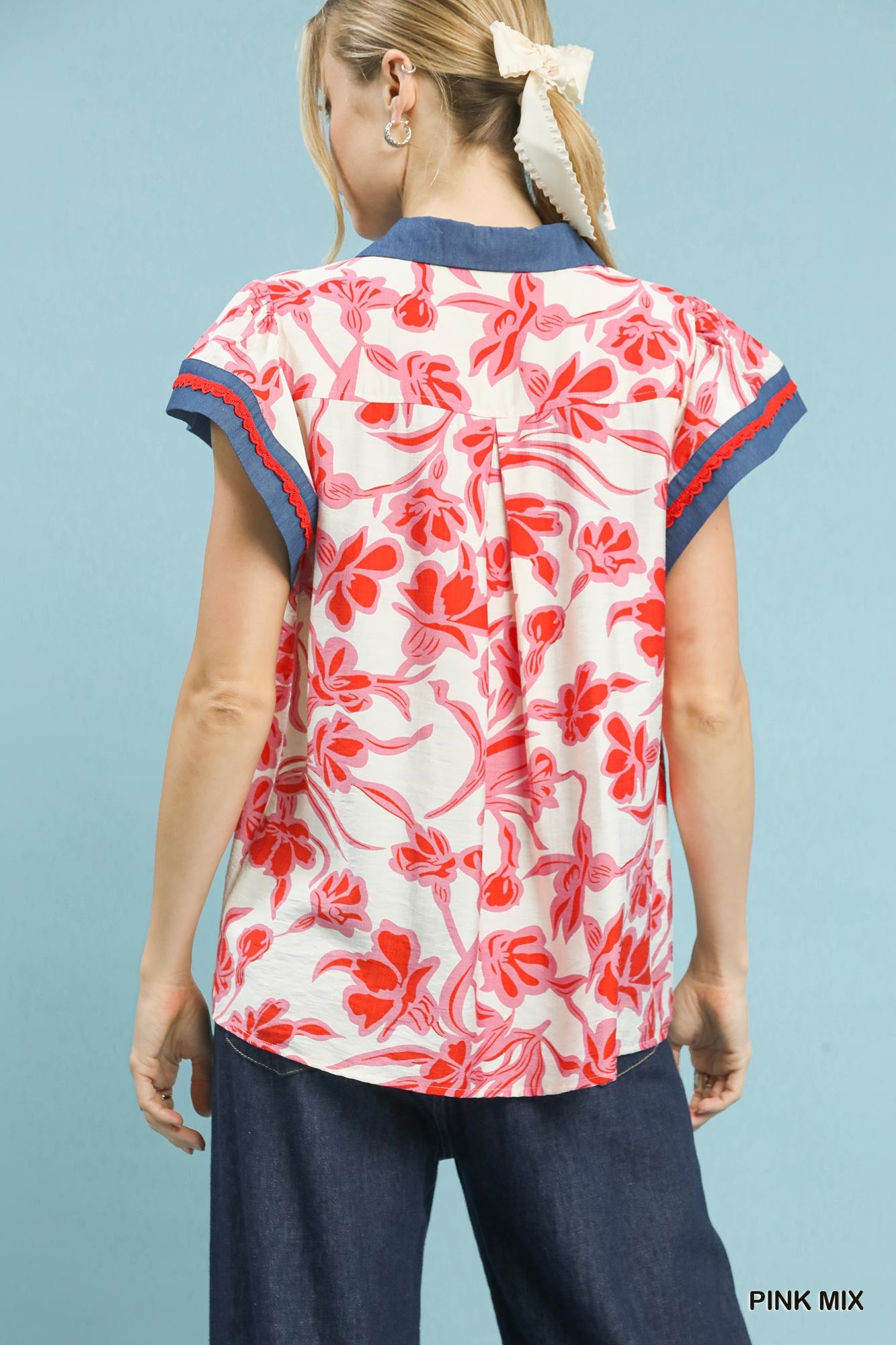 Cedar & Moore Umgee floral split-neck top by Trendsi, pink floral print with blue collar and sleeve trim.