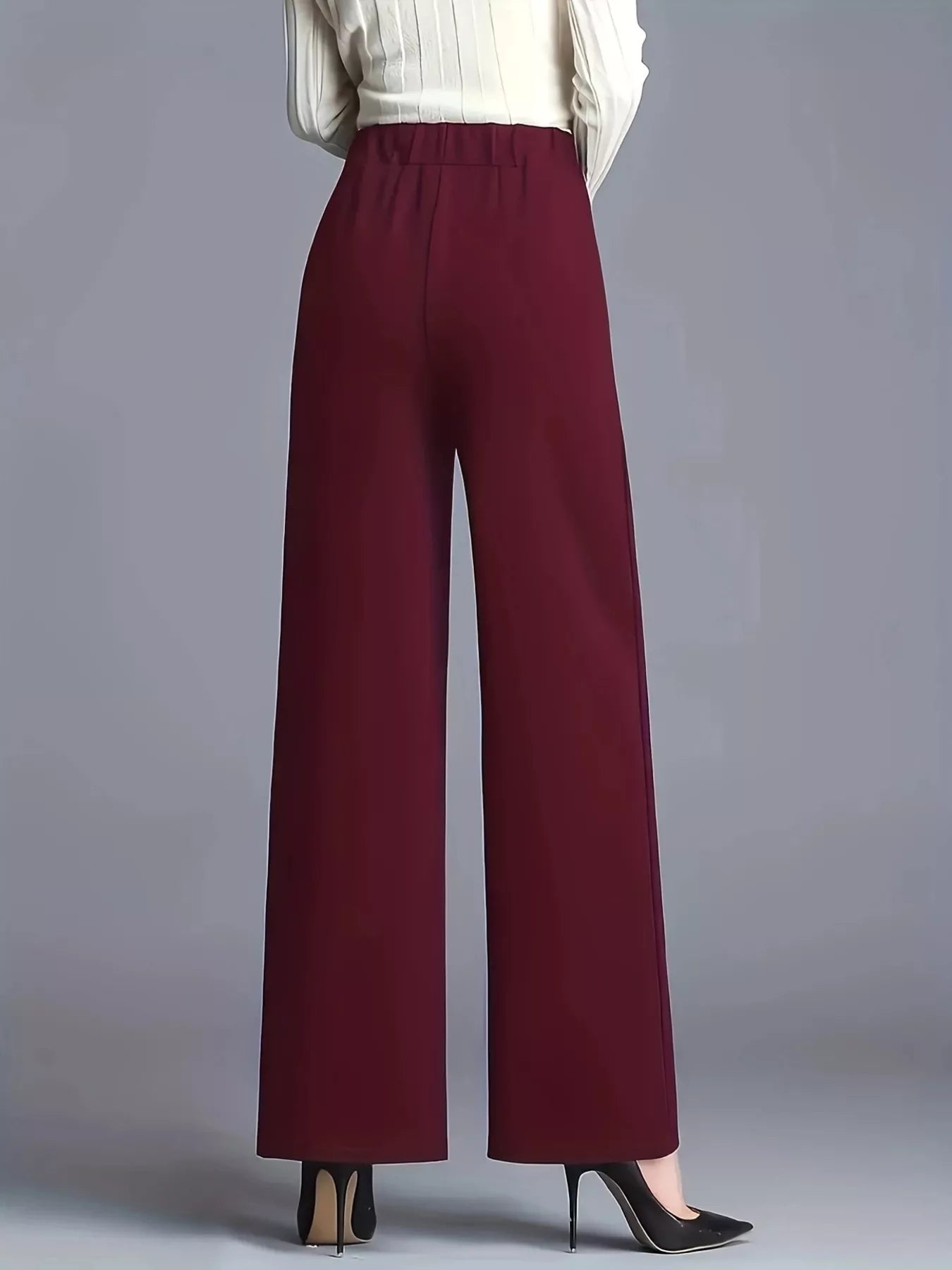 High-waisted wide-leg pants in burgundy, tailored wide-leg silhouette with smooth front and hem