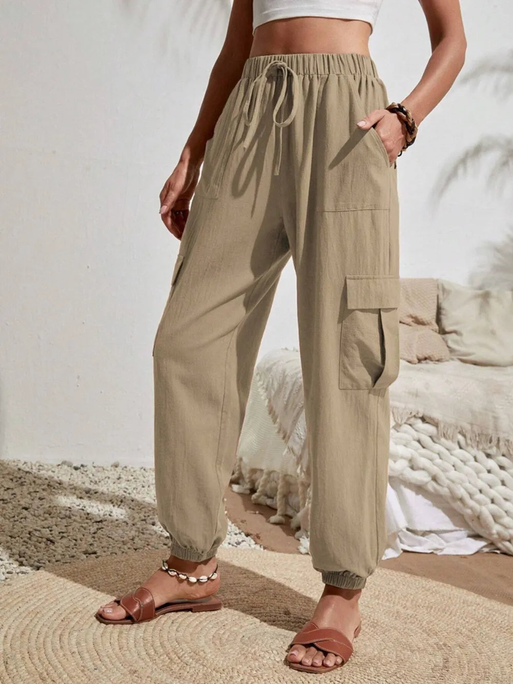 Khaki drawstring cargo joggers with side cargo pocket and cuffed ankles