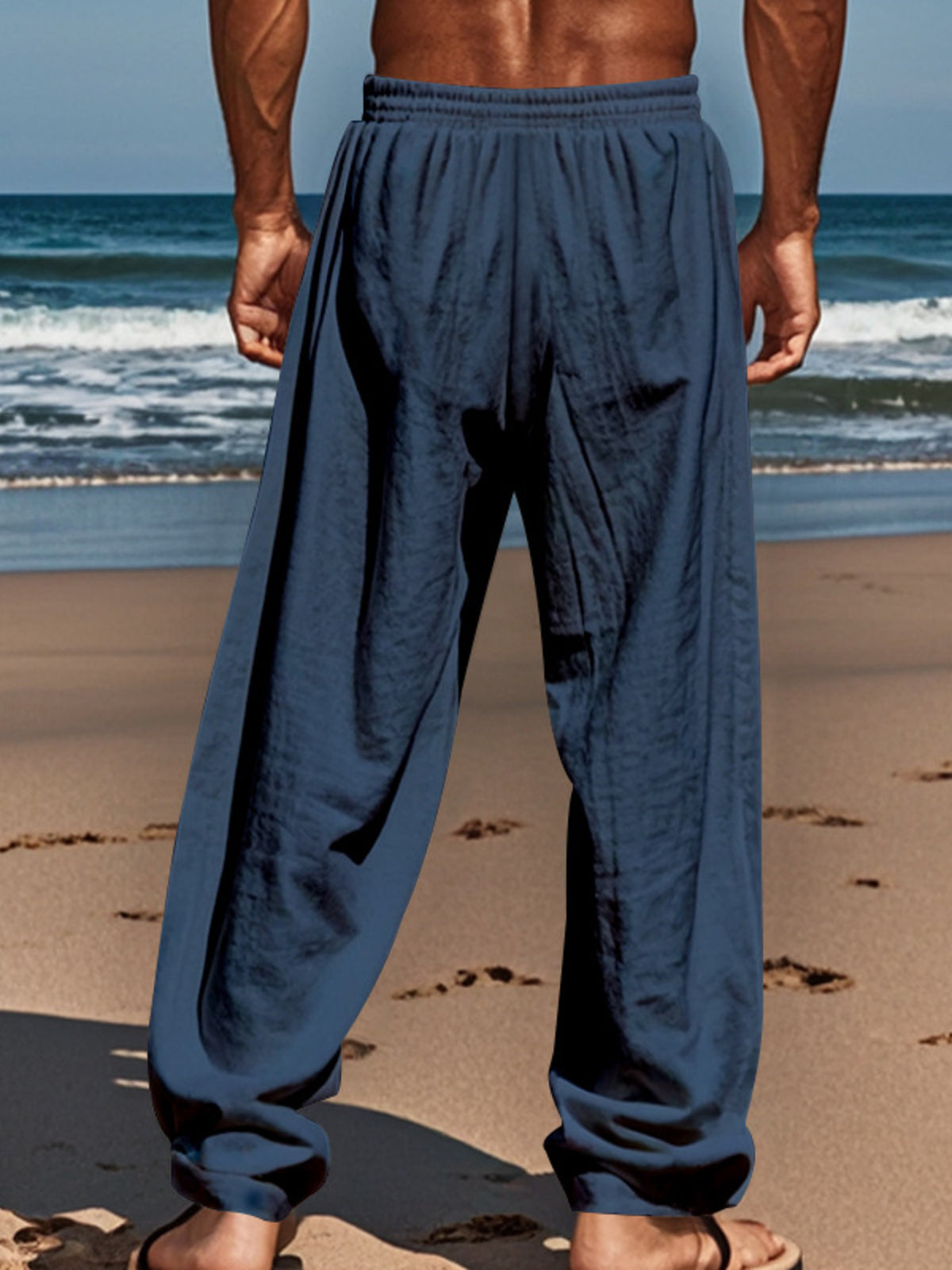 Men's loose-fit drawstring pants in dark navy, roomy leg with gathered elastic cuffs