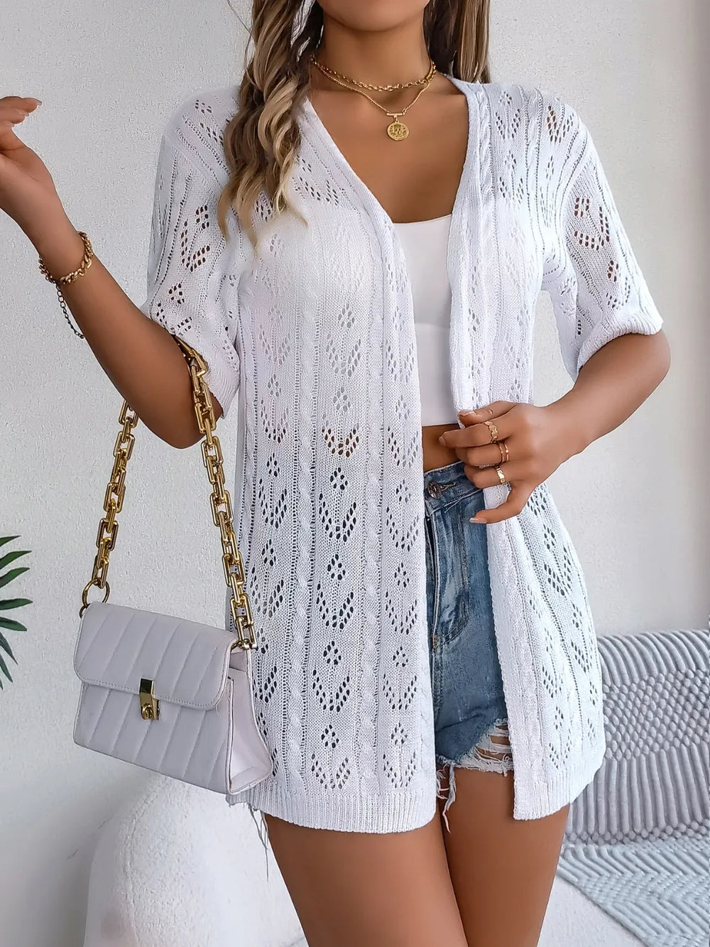 White openwork open-front half-sleeve cardigan with open knit detailing