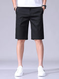 Black men's casual shorts with pockets and belt loops, knee-length style