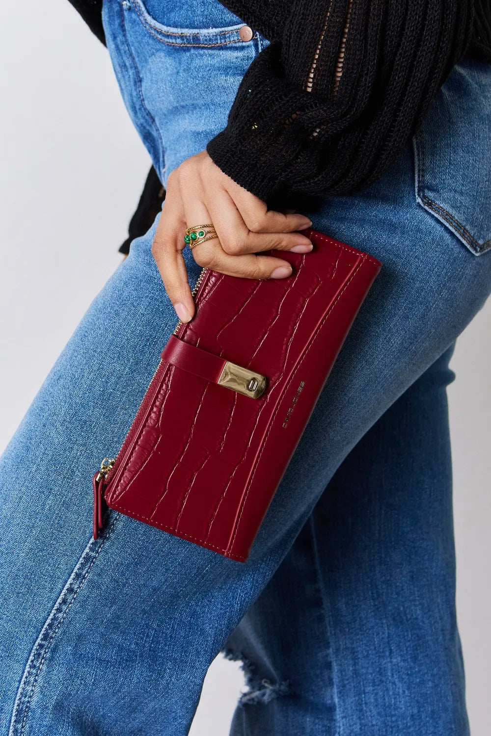 Red textured PU leather wallet with gold-tone clasp and long zipper on the side.