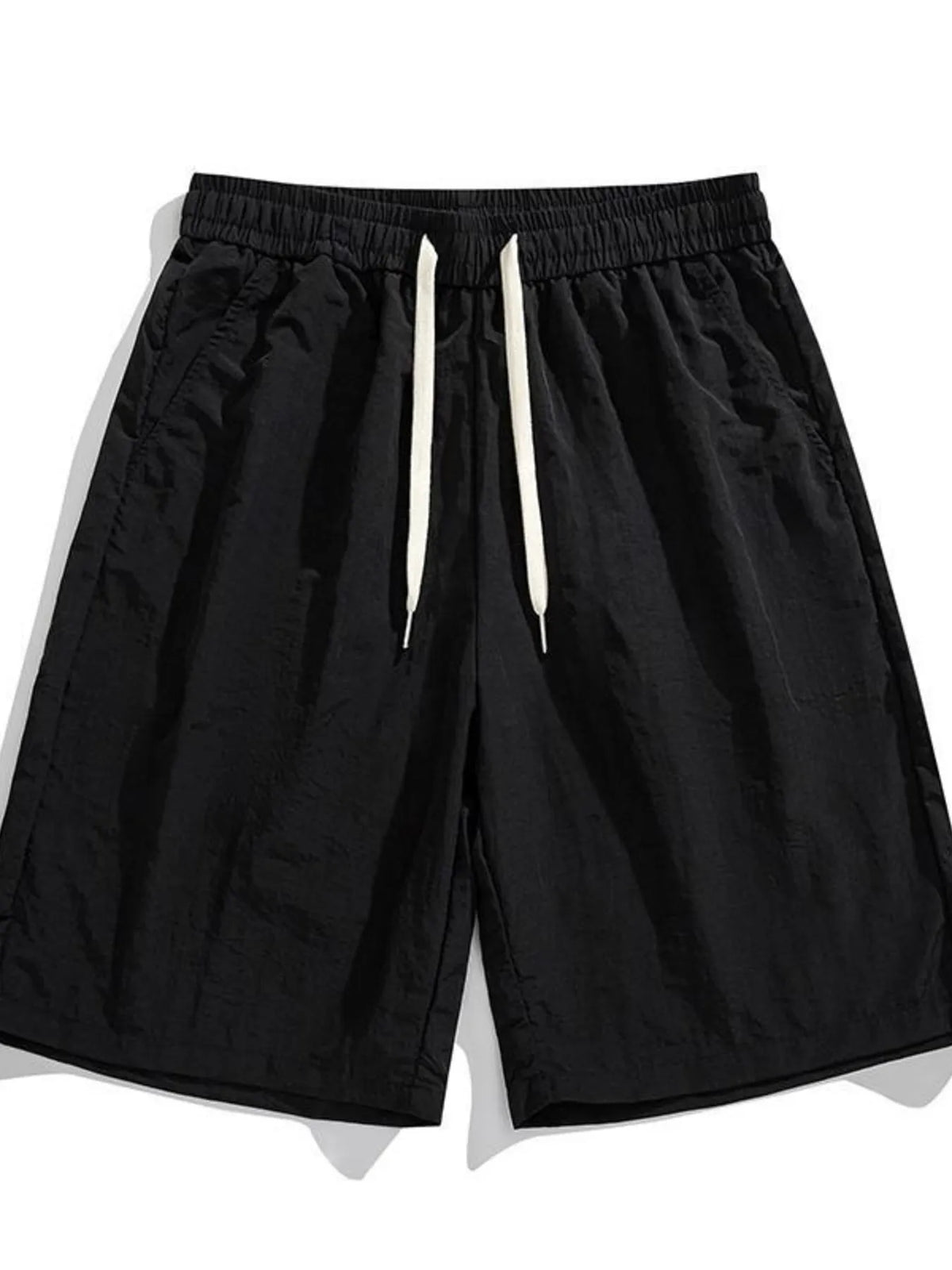 Men's black drawstring loose-fit casual shorts with elastic waistband.
