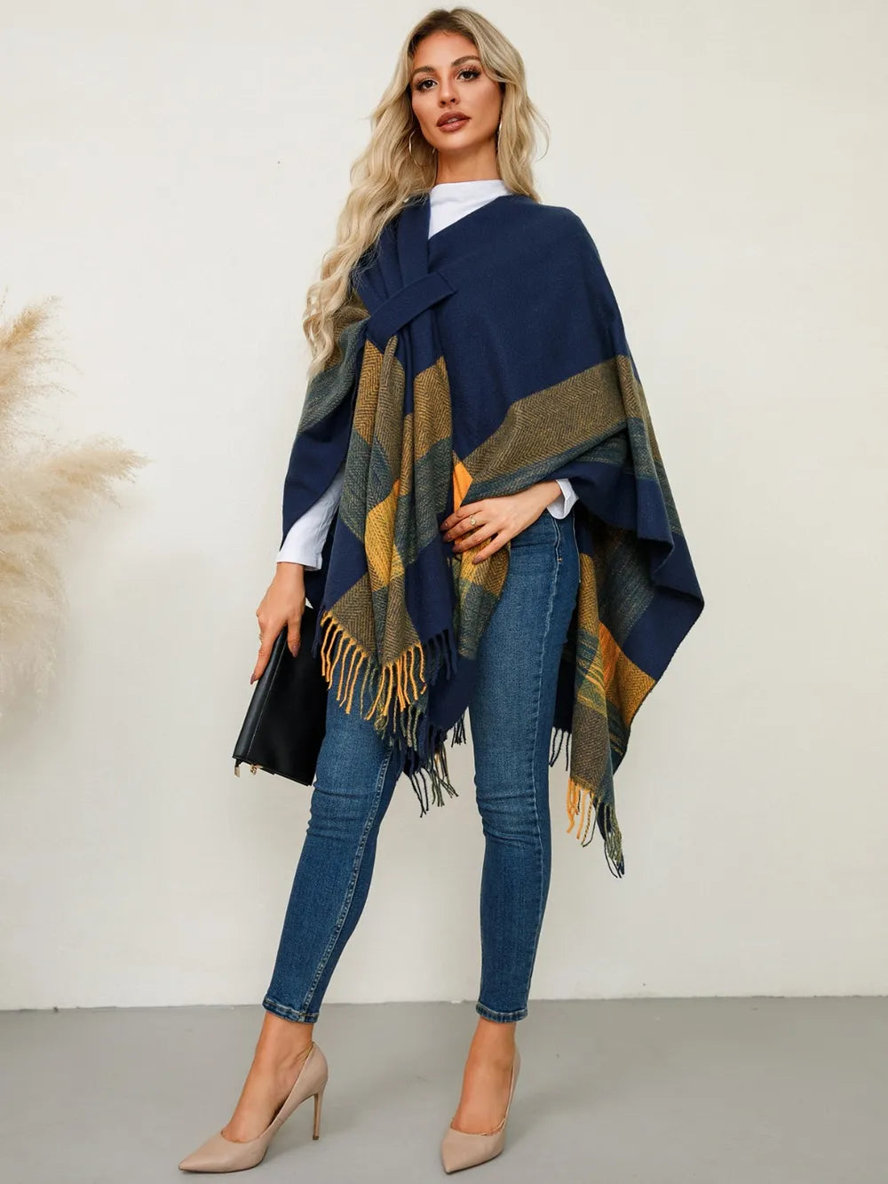 Fringe plaid poncho in navy with olive and gold check blocks, draped sleeves, tassels