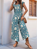 Turquoise printed wide-leg jumpsuit with round neck and cap sleeves, flowy culotte length