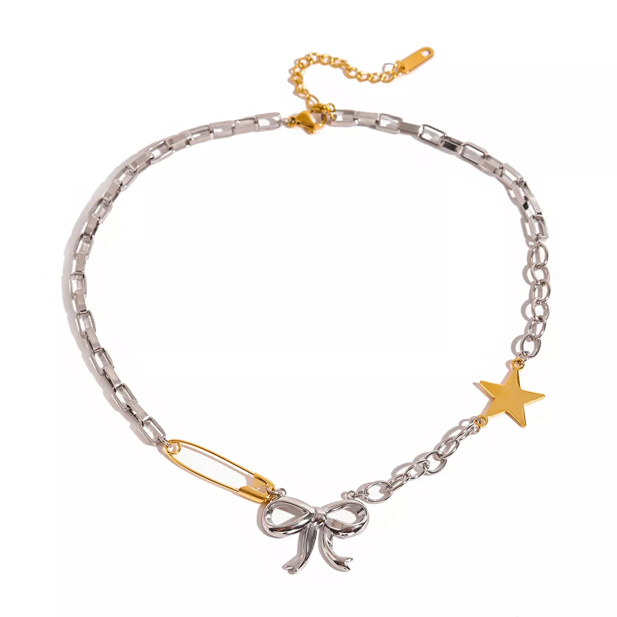 Two-tone star bow necklace with silver chain, gold star charm, and ribbon bow pendant