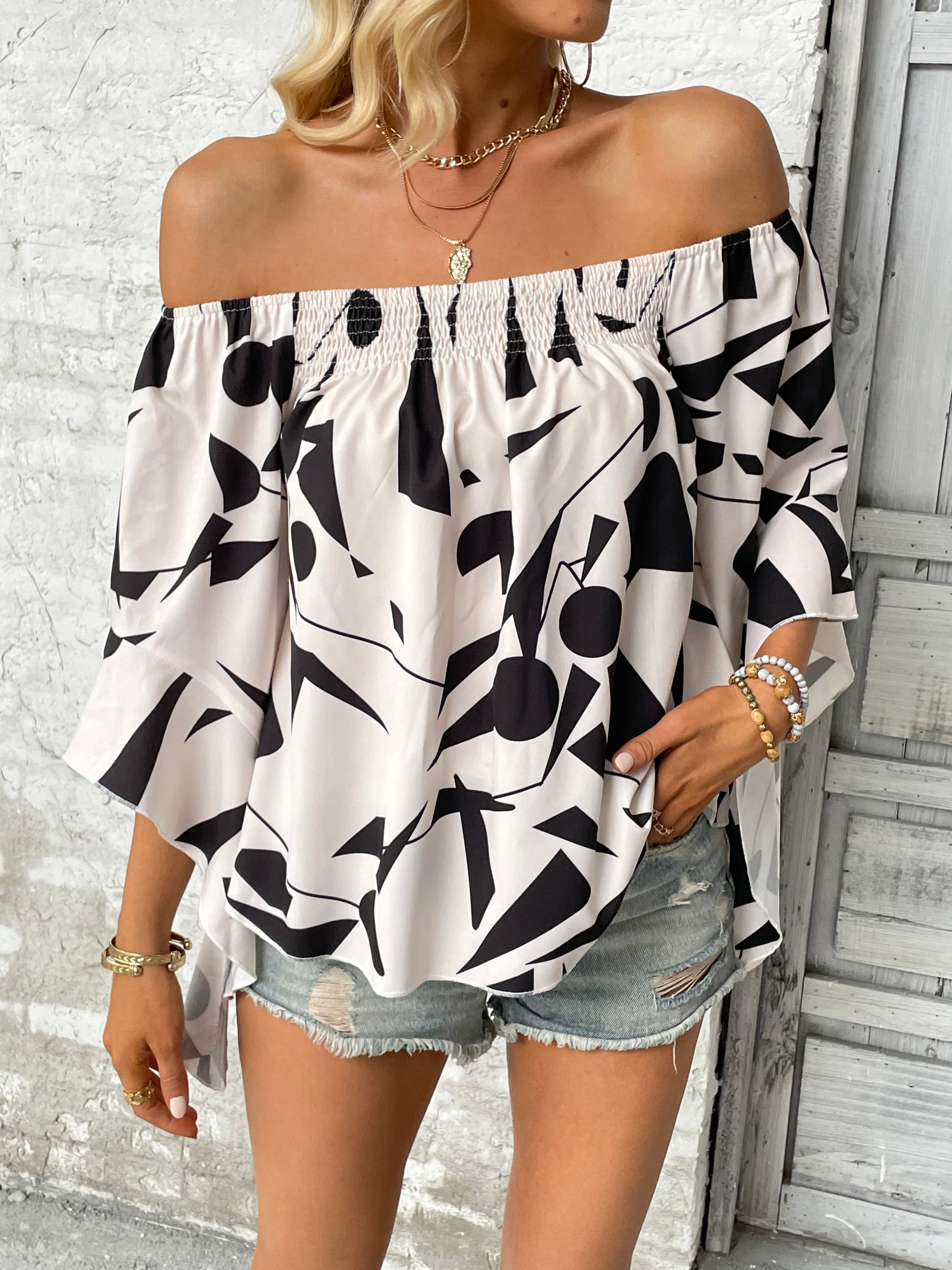 Off-shoulder bell sleeve blouse in black and white abstract print, loose sleeves