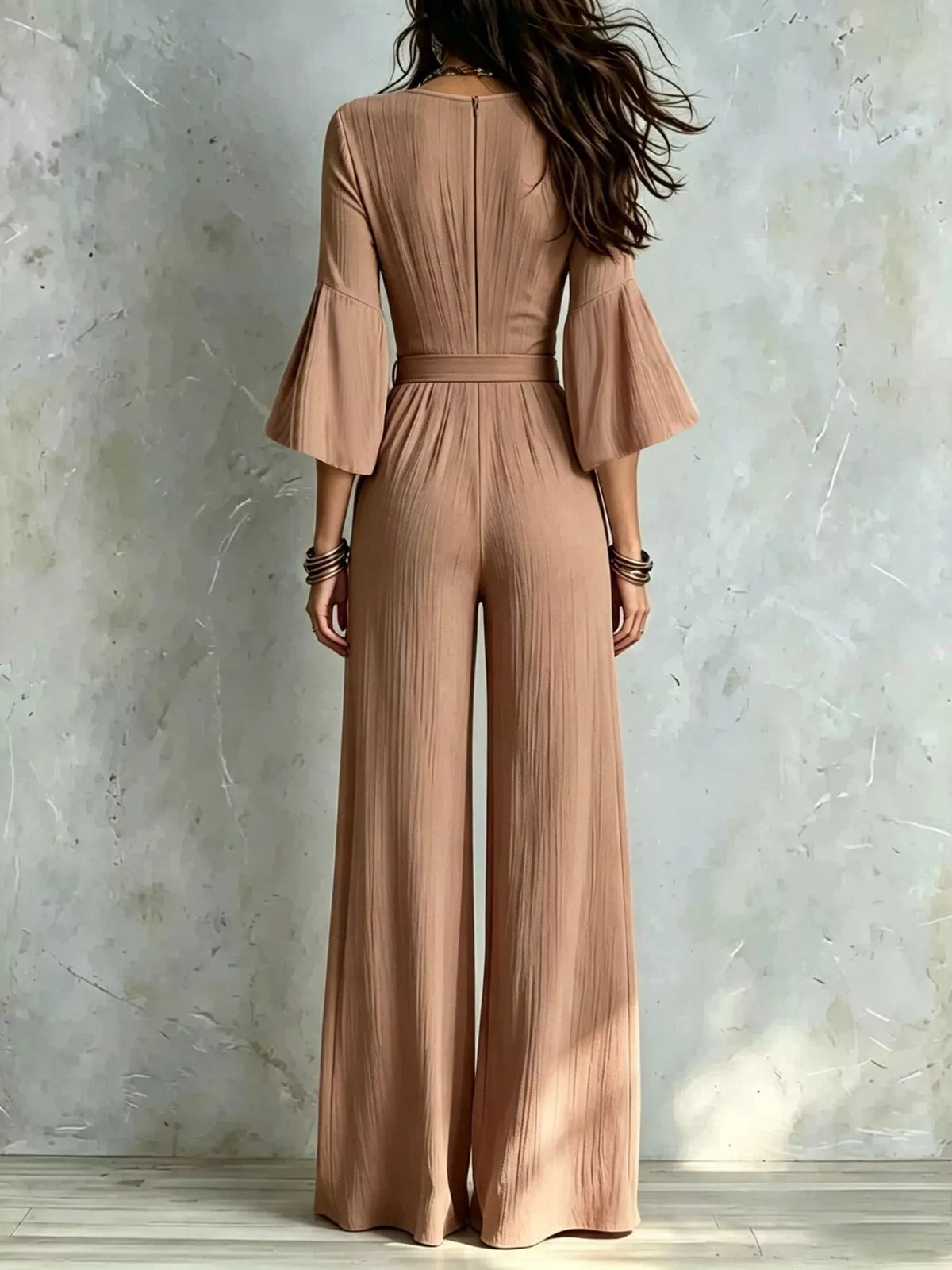 Light brown tie-waist wide-leg jumpsuit with pleated back and wide bell sleeves
