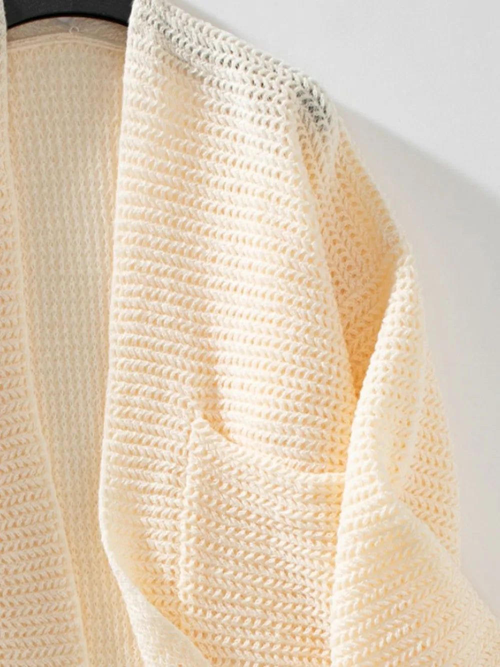 Open front long sleeve cardigan, cream textured knit with curved front opening