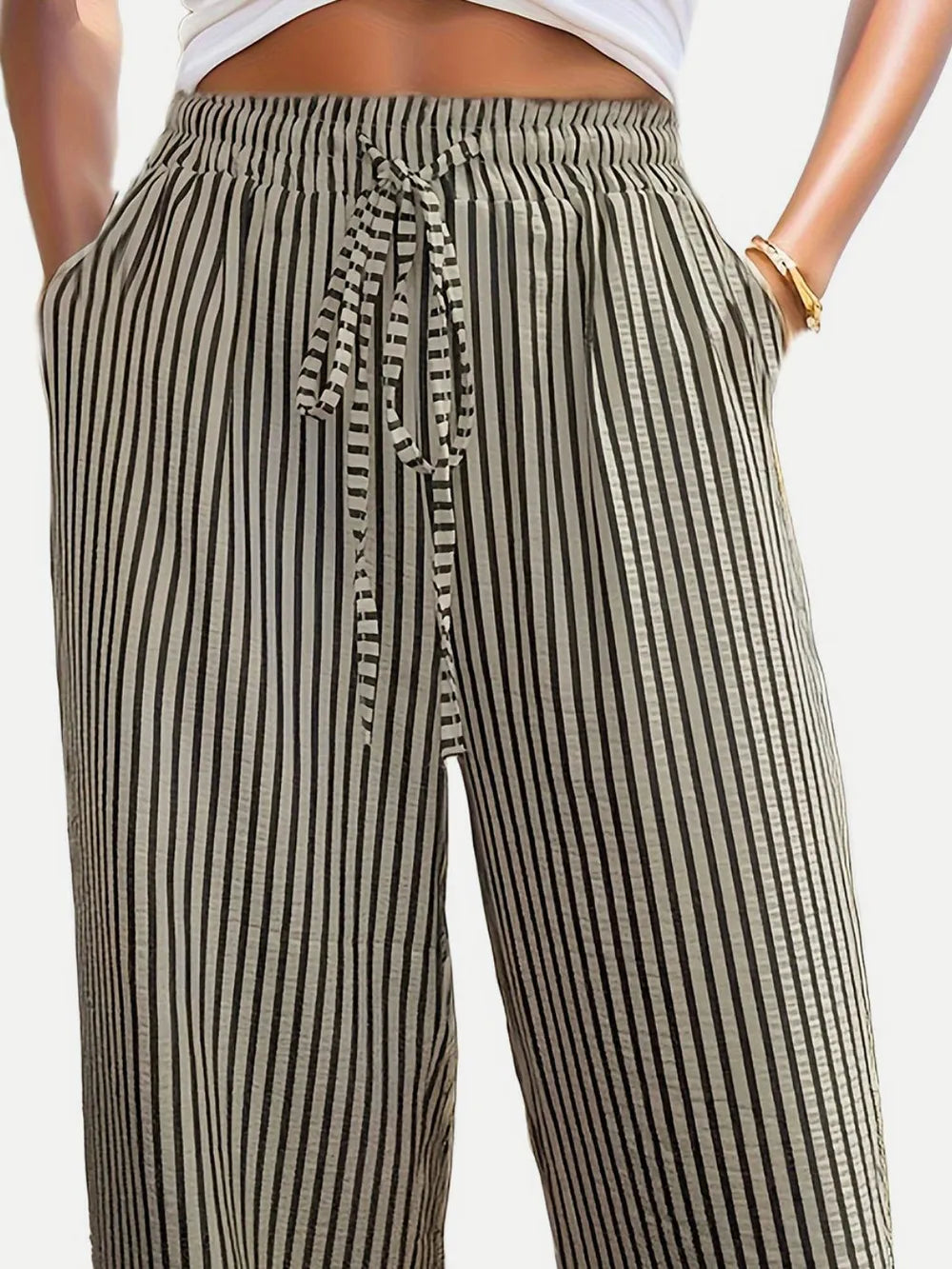 Striped elastic waist drawstring pants with front tie detail, black and white stripes