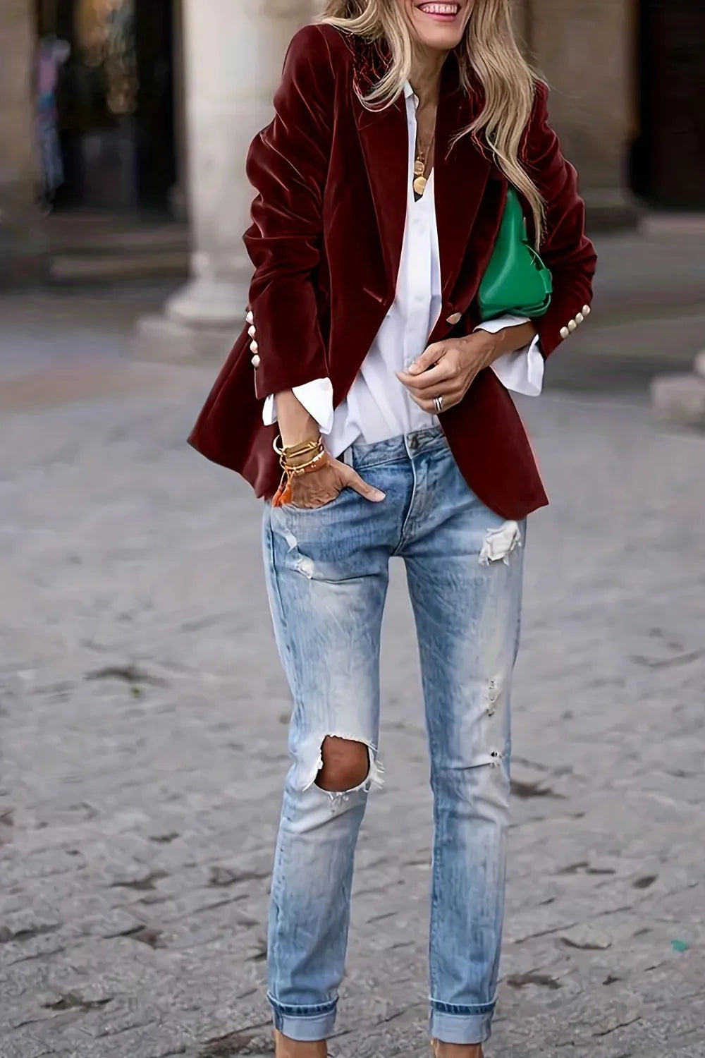 Burgundy one-button lapel blazer with long sleeves and notched lapels over white shirt.