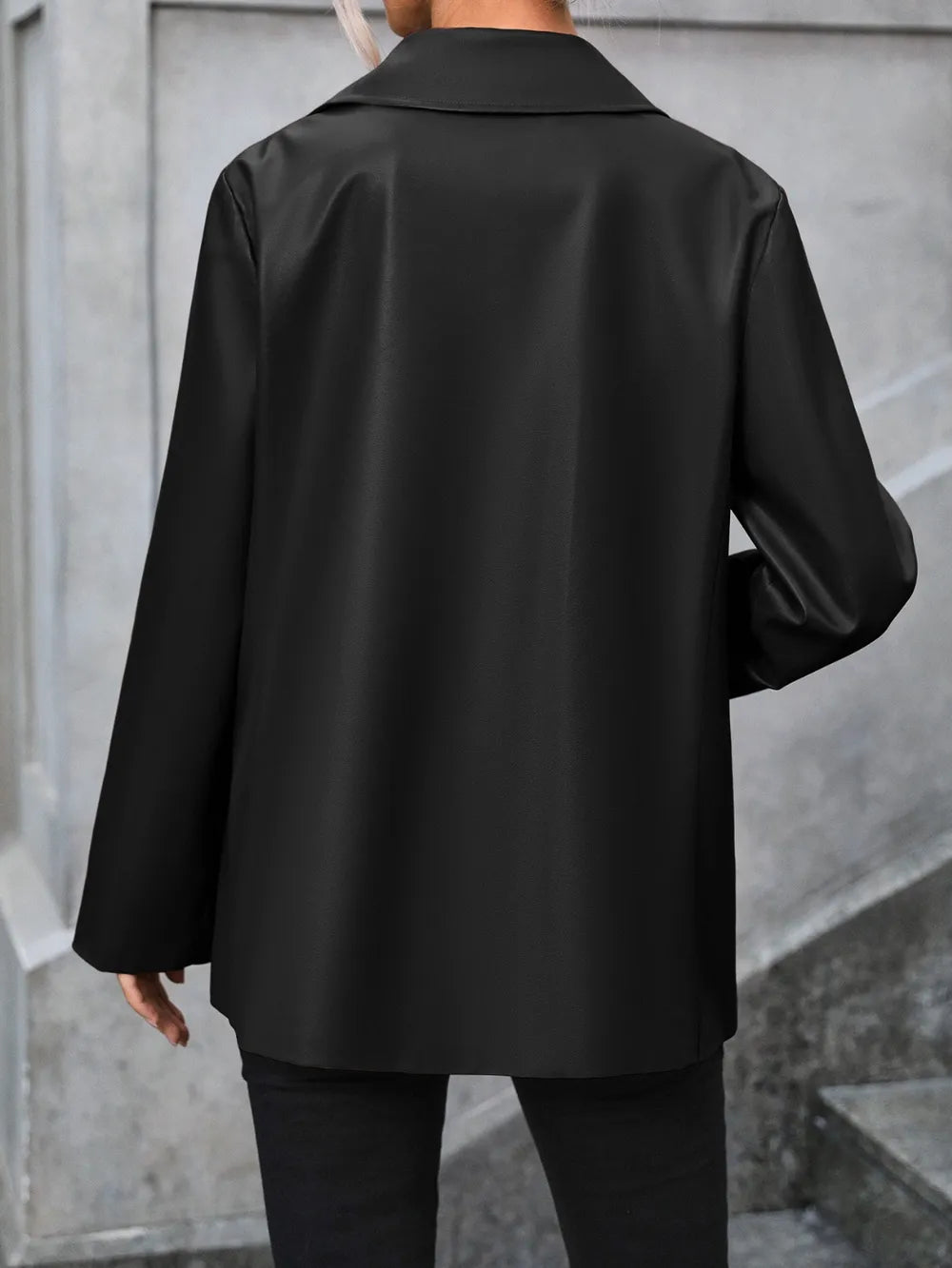 Black collared blazer with long sleeves, back view