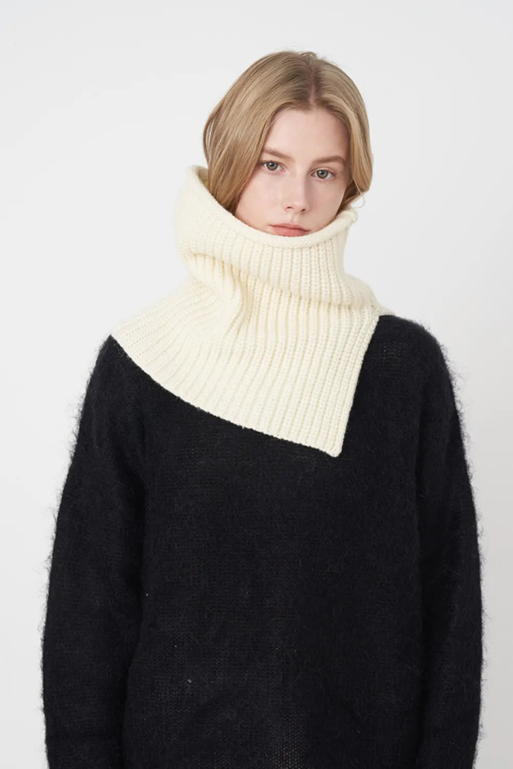 Ivory ribbed knit pullover scarf worn as a folded cowl at the neck