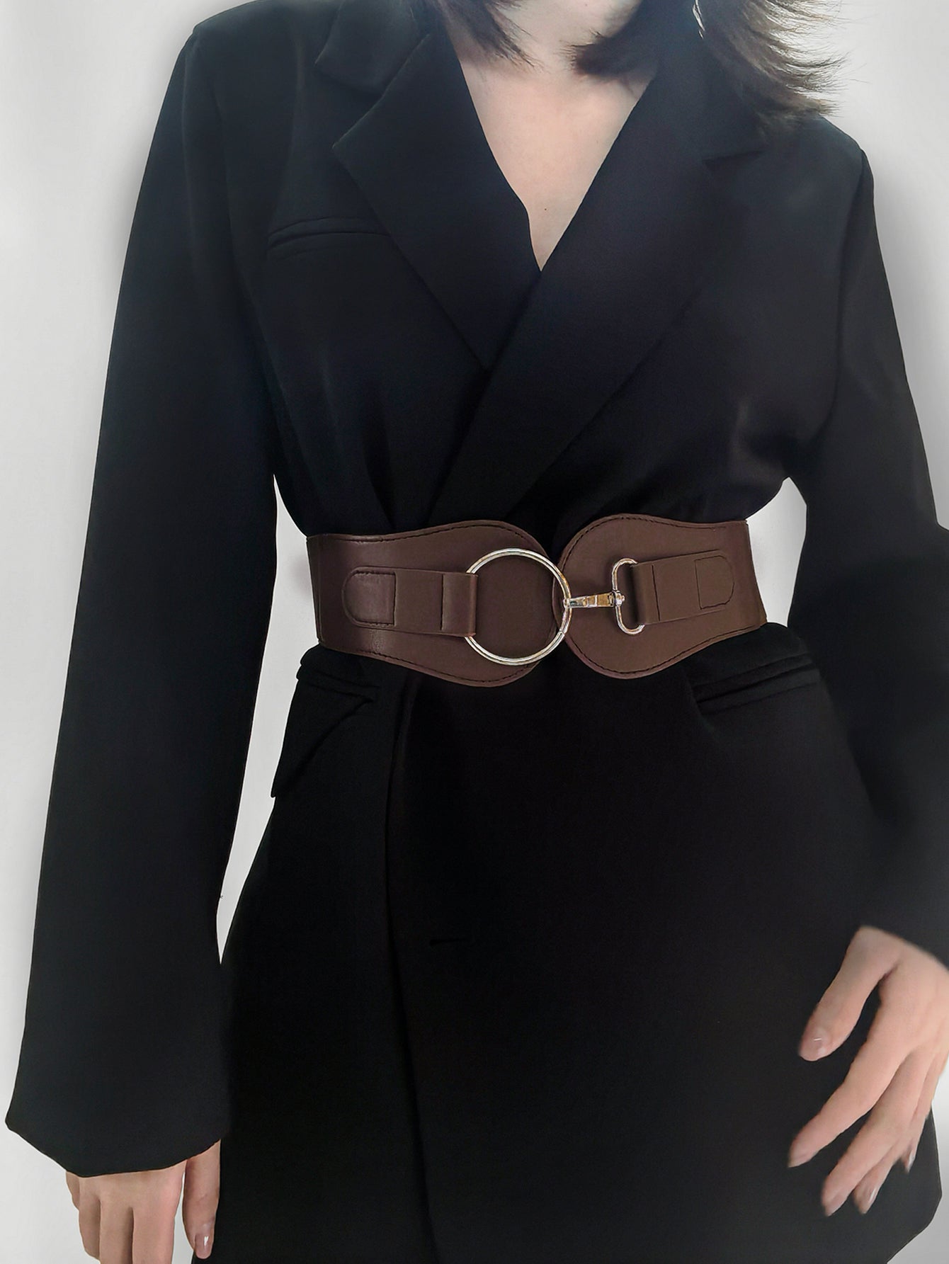 Wide elastic vegan leather belt in caramel brown with oval buckle and adjustable loops