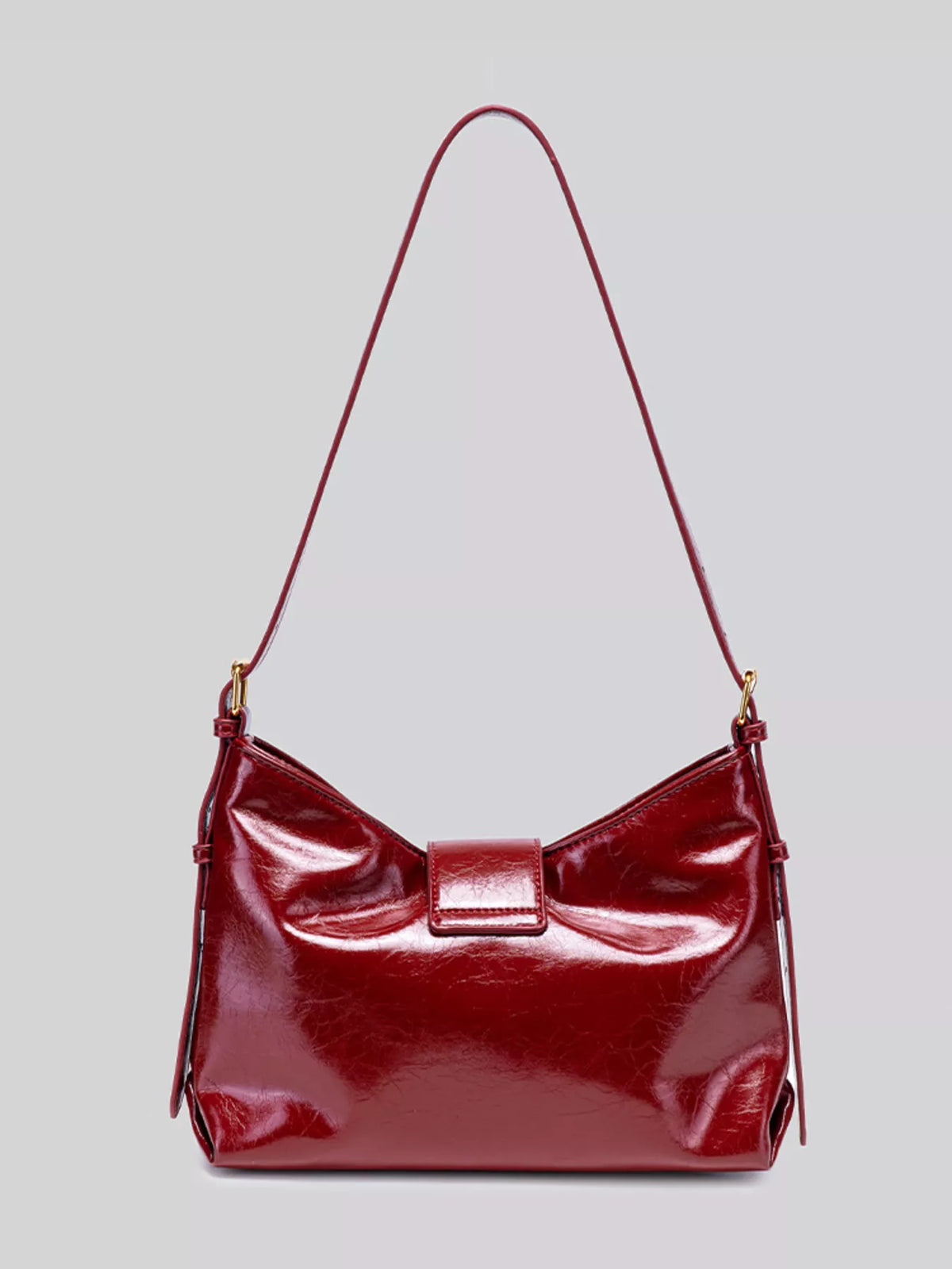Wine red gloss vegan leather crescent shoulder bag with top center clasp and short handles