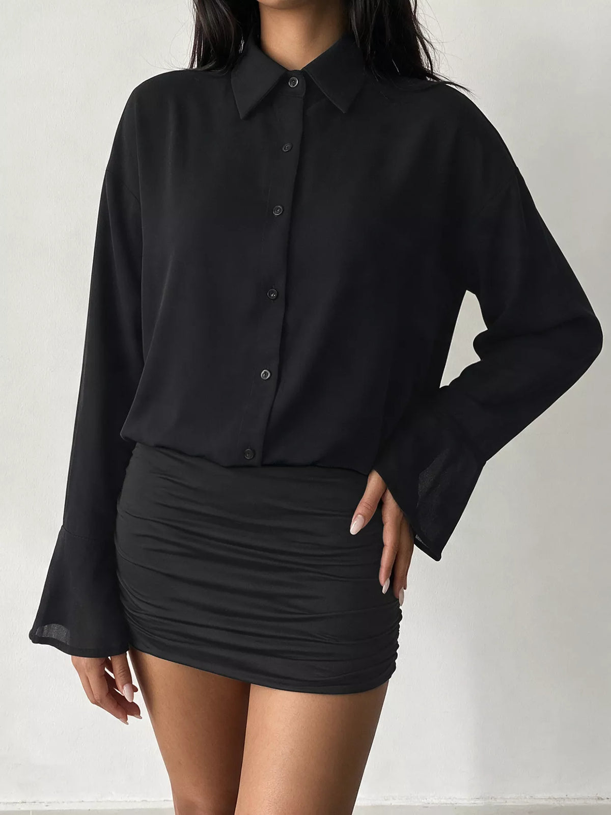 Black button-up shirt dress with ruched bodycon skirt and flounce cuffs