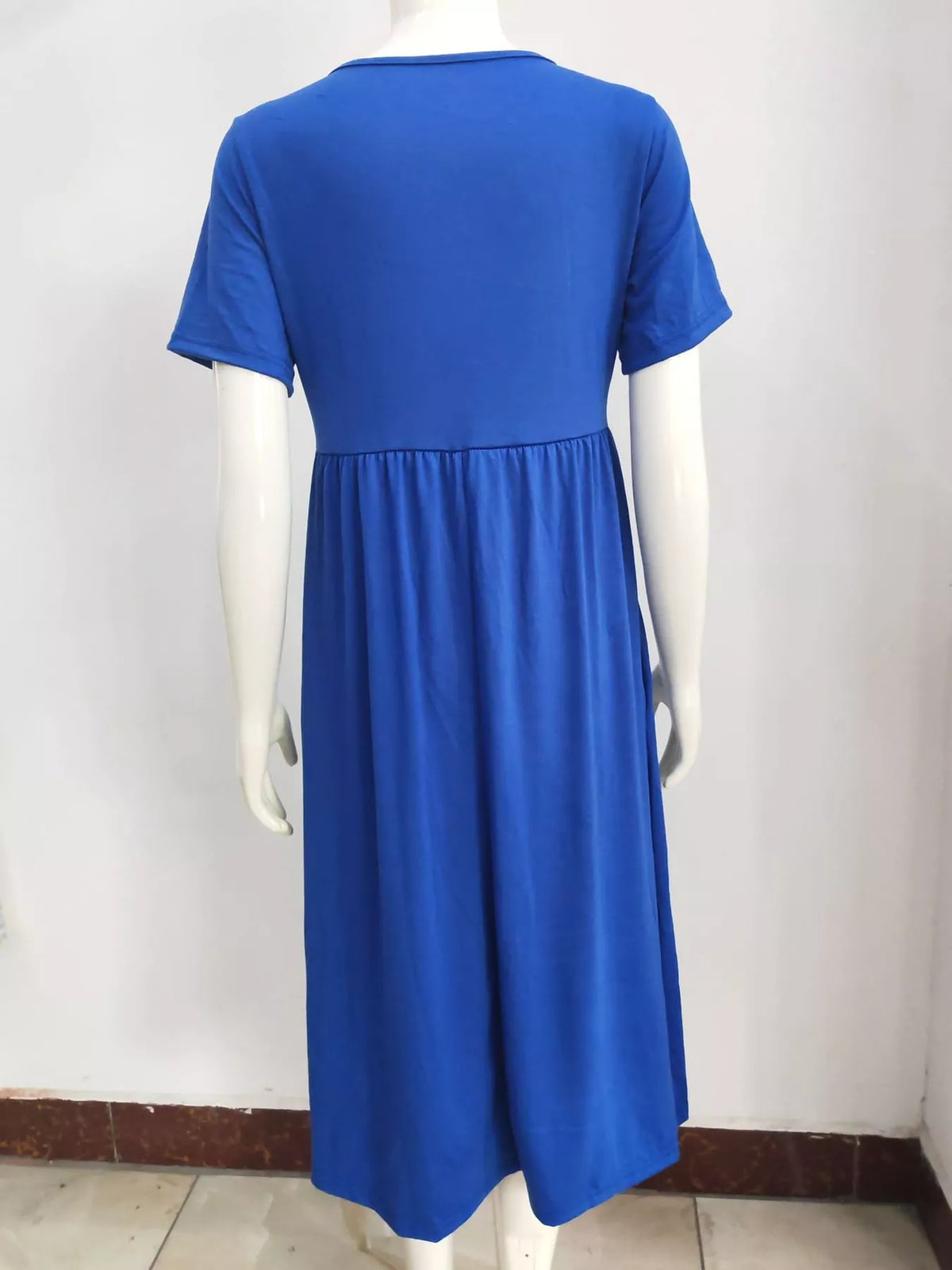 Blue crisscross high-waist midi dress on a mannequin, back view