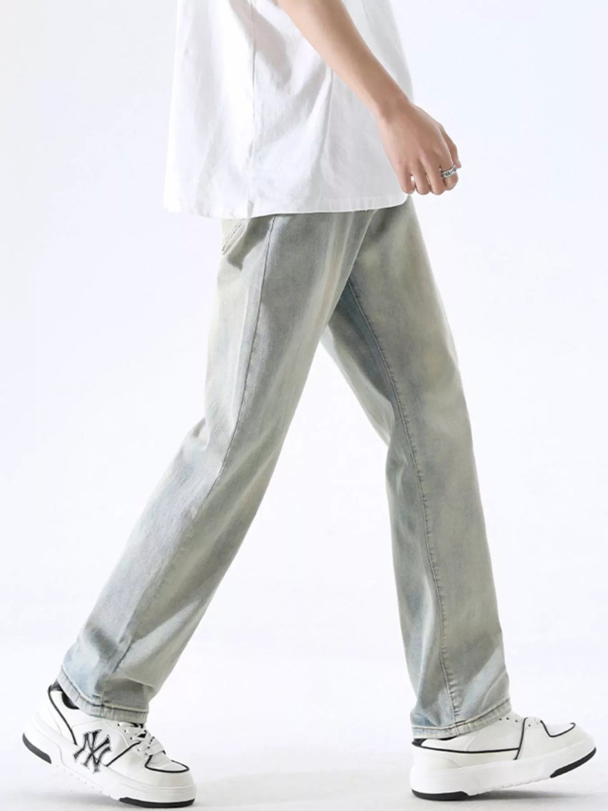 Washed light gray wide-leg stretch jeans with classic seams and relaxed long legs.