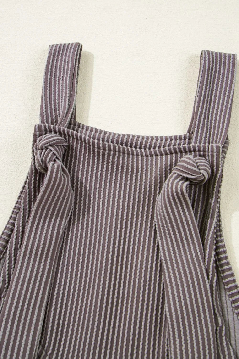 Striped overall bodice with adjustable straps and tied shoulder knots