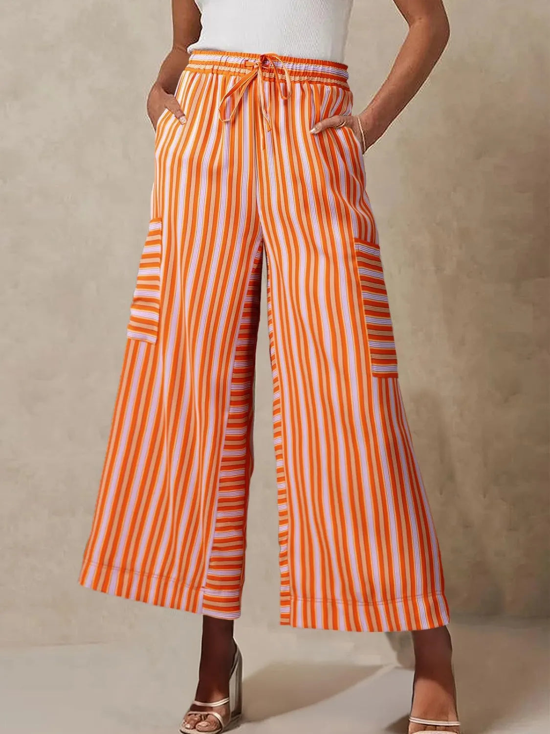 Tangerine orange striped wide-leg pants with elastic waist and contrast side pockets