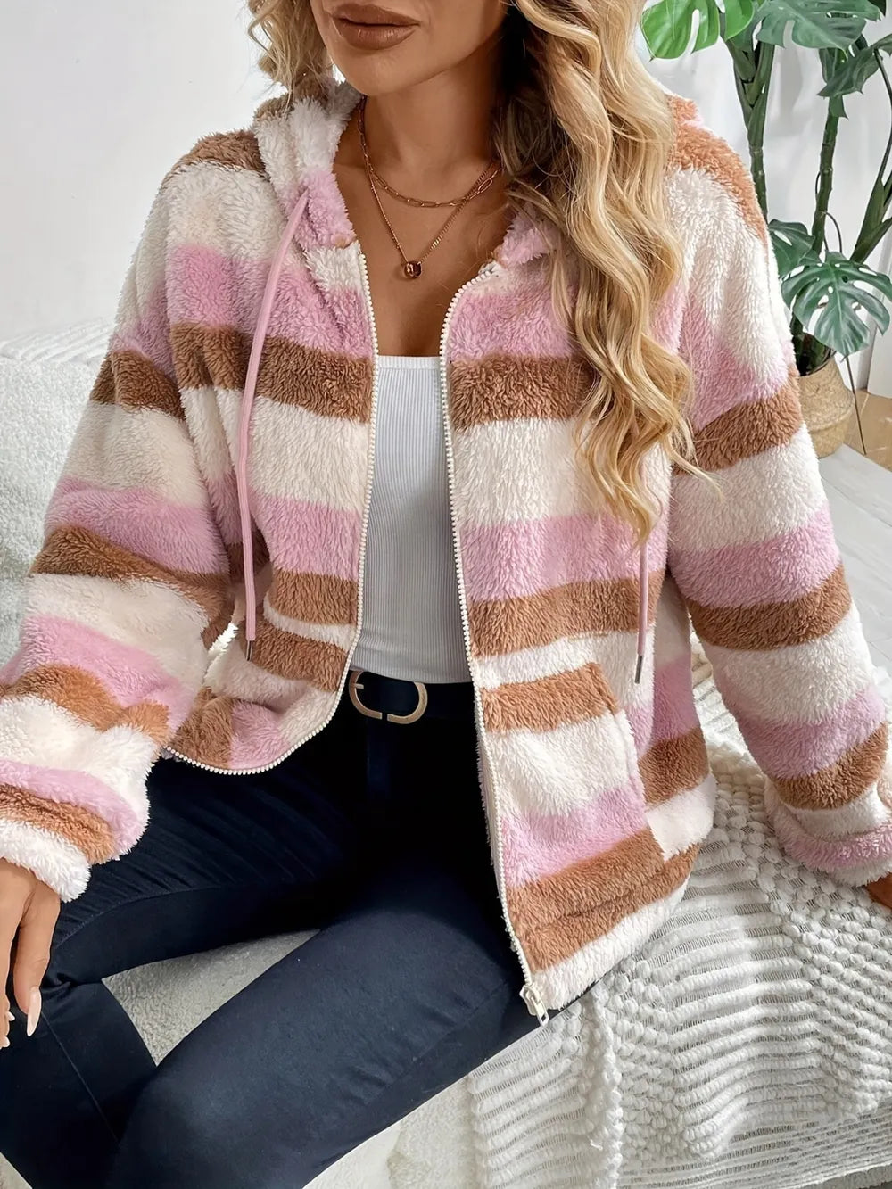 Striped zip-up hooded jacket in blush pink with brown and cream stripes, front view