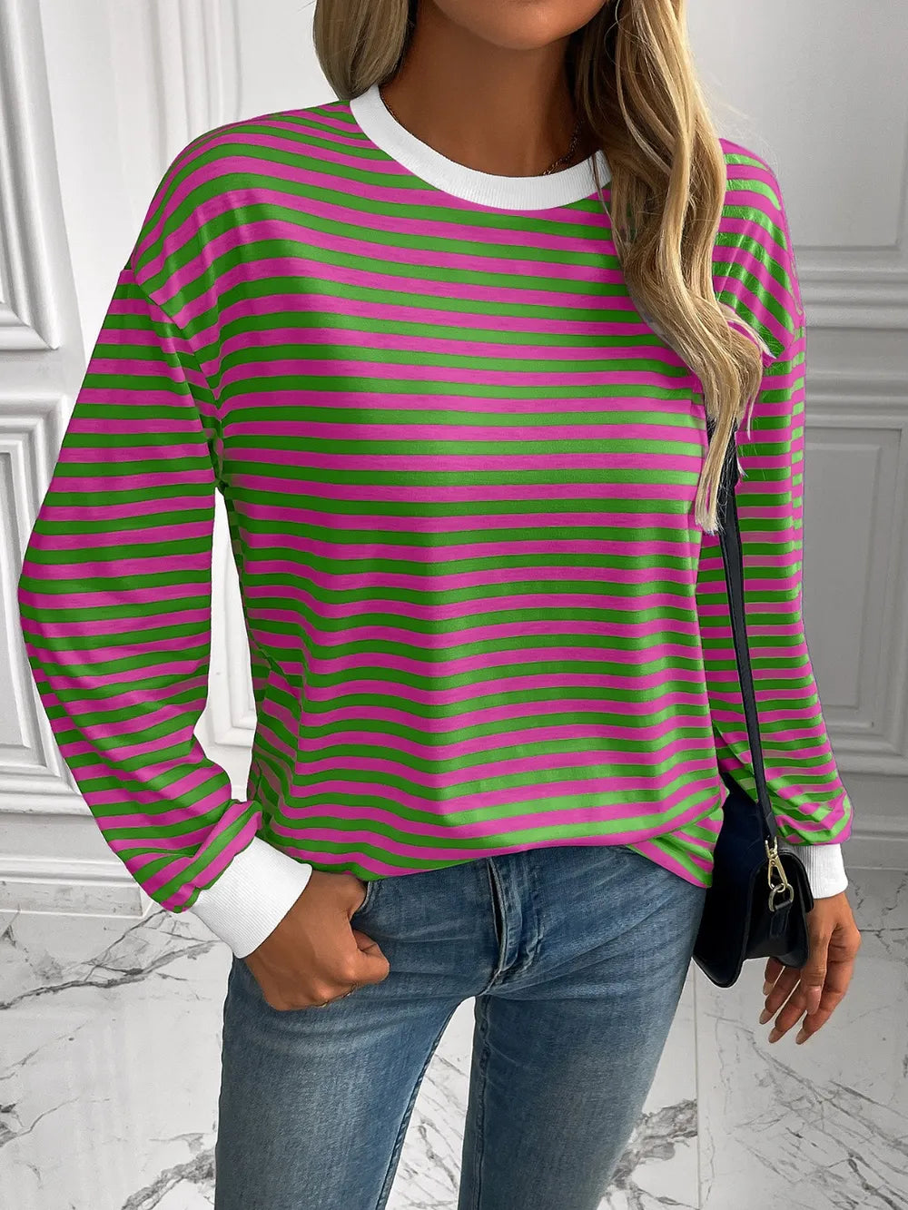 Green and pink striped round-neck sweatshirt with long sleeves and white cuffs