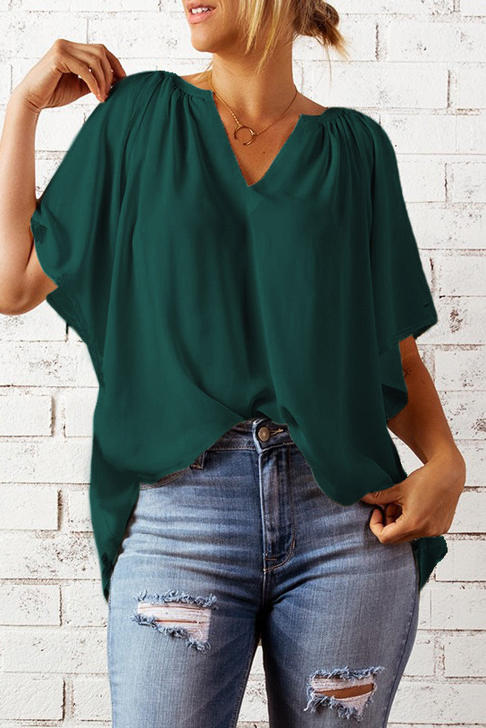 Green gathered flutter sleeve top with notched neckline