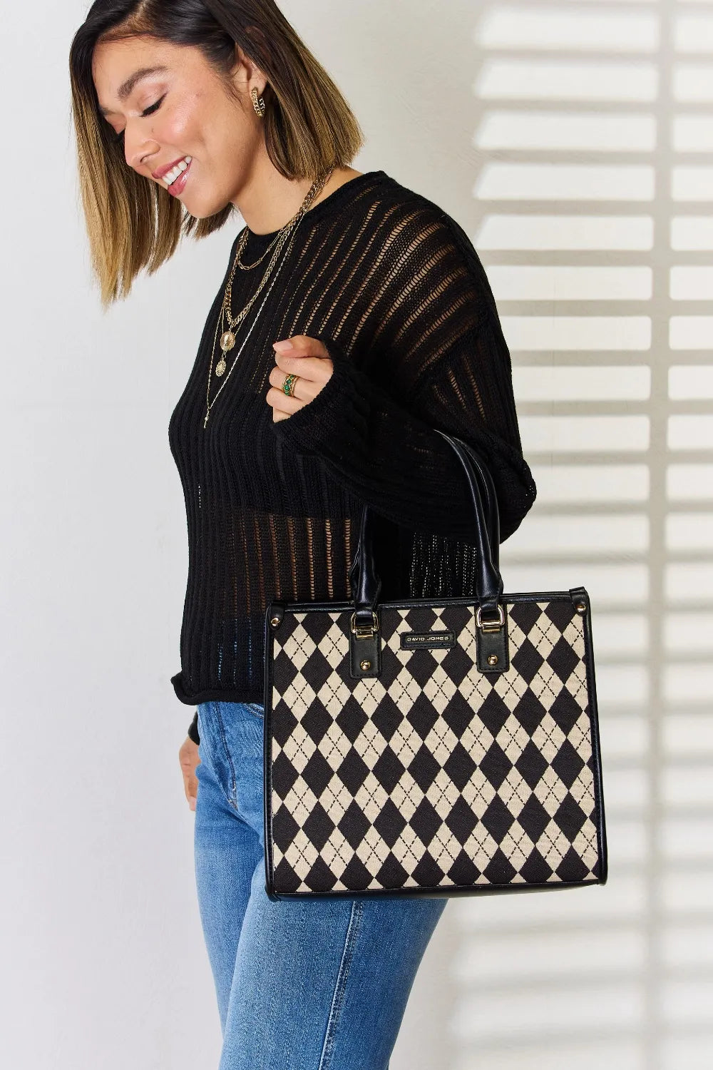 Argyle-pattern PU leather handbag with top handles, cream-and-black diamond pattern