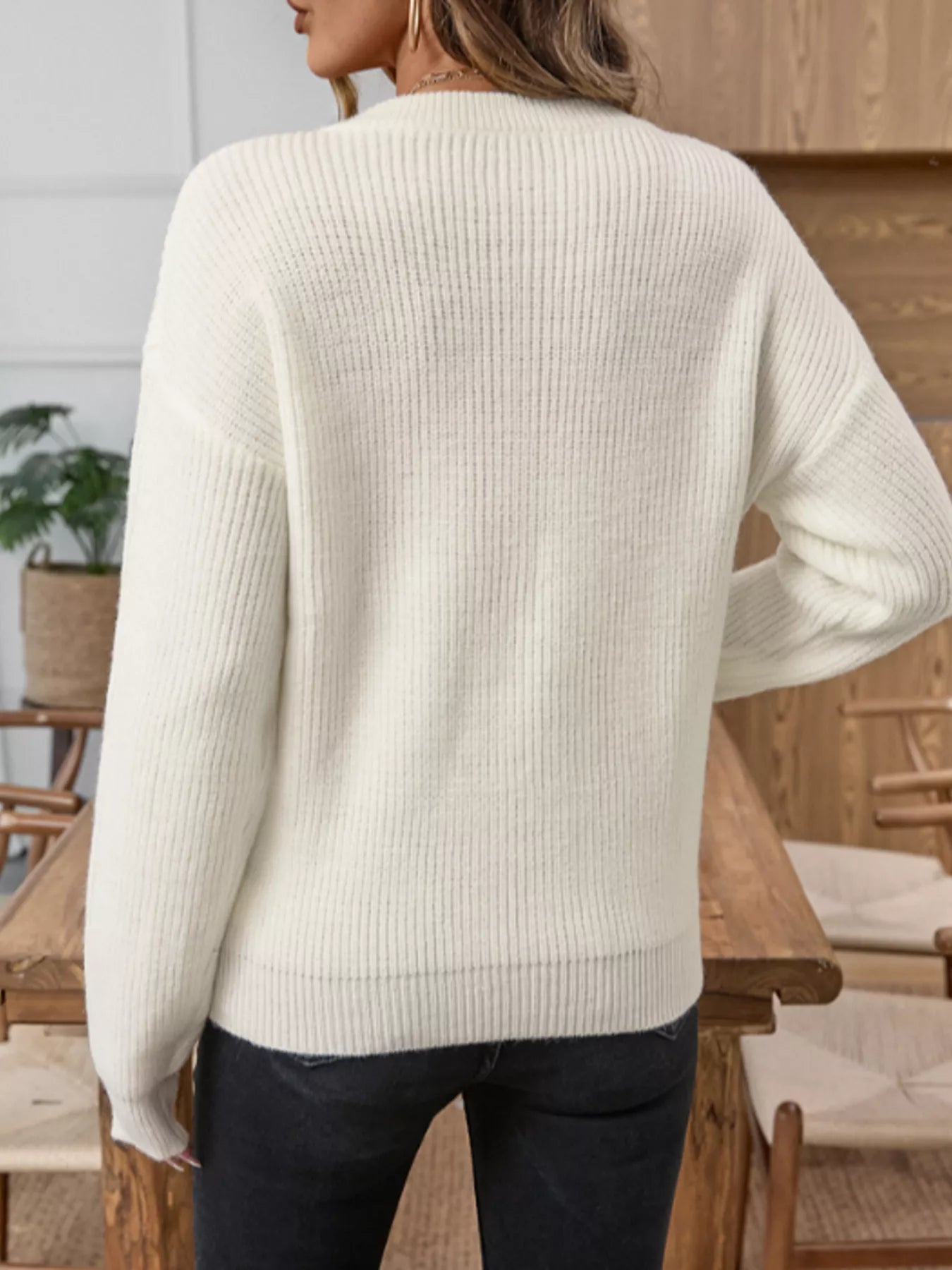 Cream long-sleeve knit sweater with ribbed texture and rounded neckline (back)