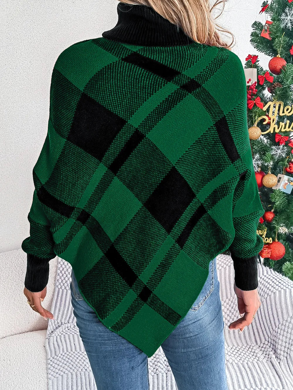 Plaid turtleneck batwing sweater in dark green with black plaid, back view and ribbed cuffs.