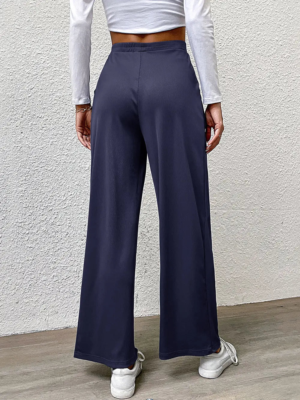 High-waist straight navy pants, full back view with wide legs