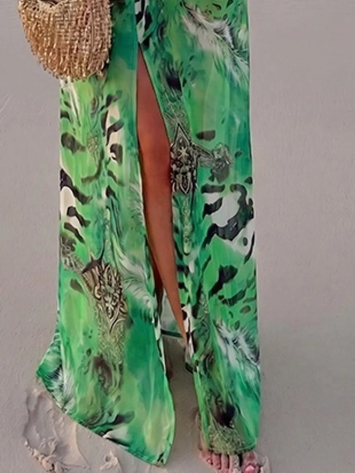 Green printed flowy maxi dress with deep V neckline and long puff sleeves