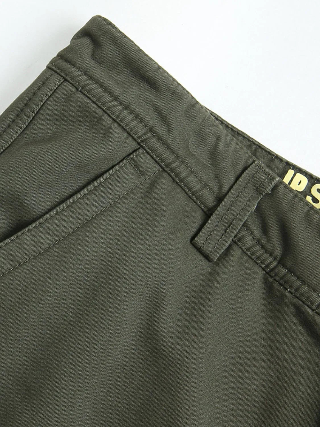 Men's solid cargo pants in dark green with stitched waistband and front pocket