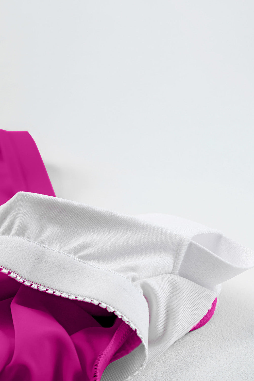 Ruched tankini bottom with magenta side slit and white contrast trim