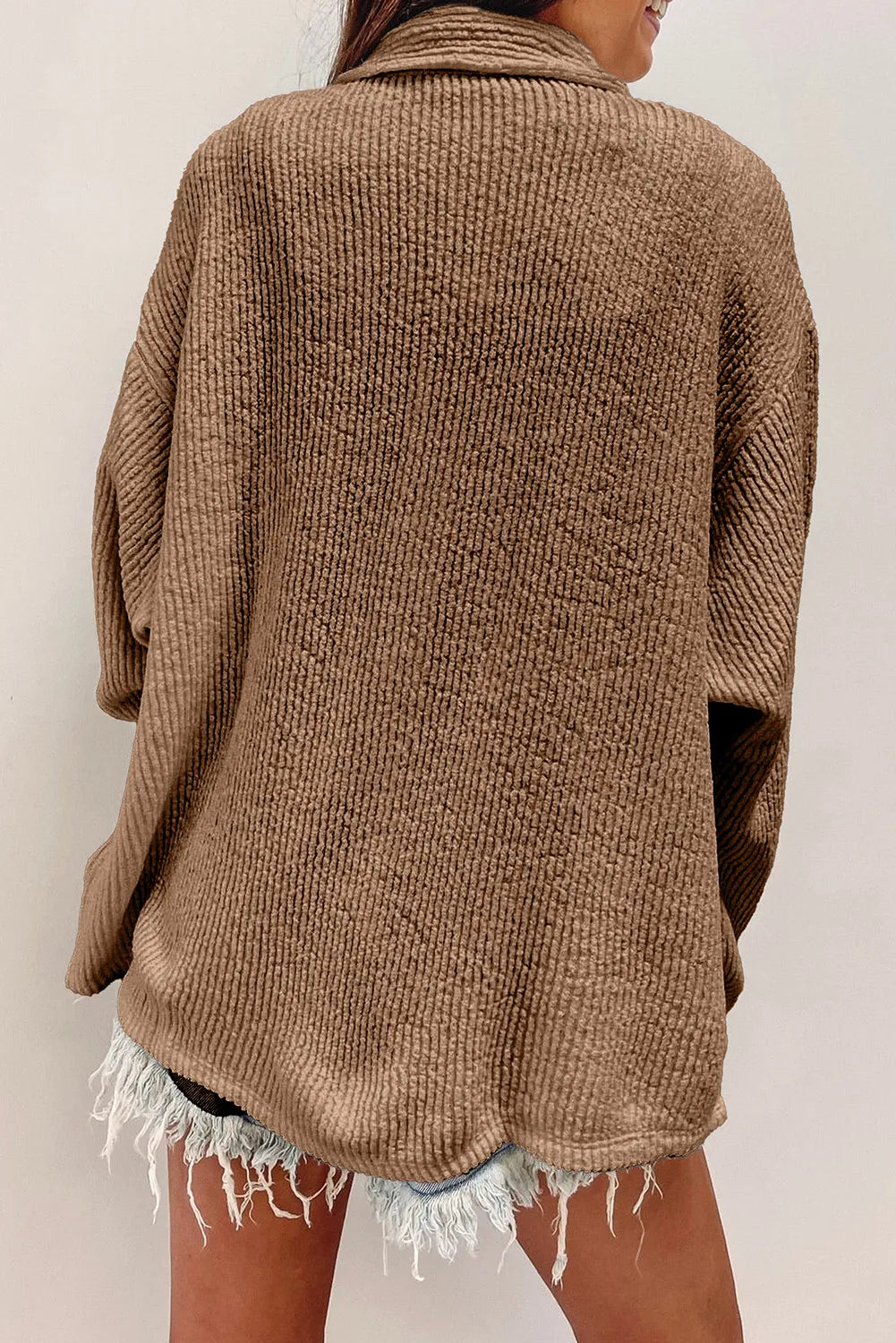 Camel textured button-up long sleeve shacket from back view, with yoke seam and loose fit