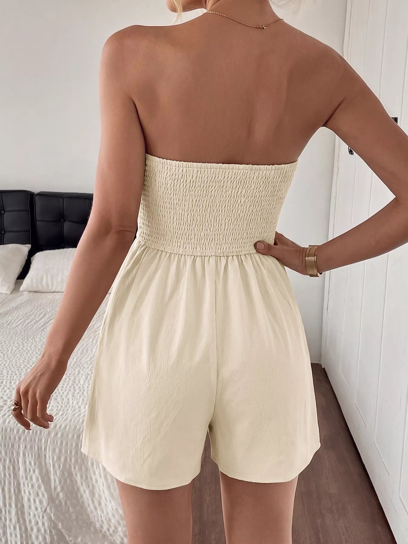 Cedar & Moore Strapless Pleated Detail Romper in cream with smocked bodice, back view