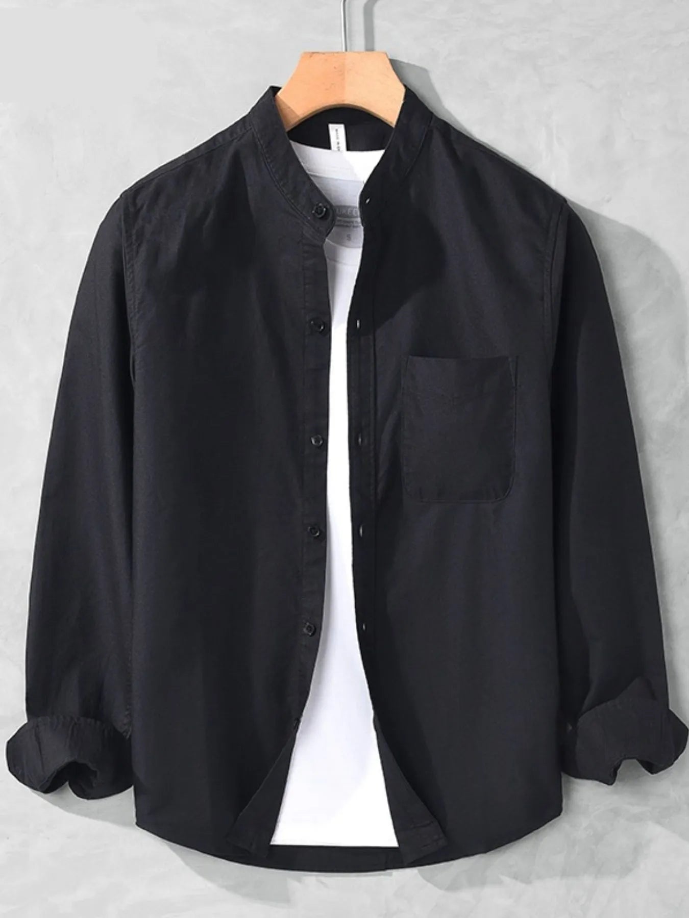 Black men's plus-size button-up long-sleeve shirt with chest pocket, front view