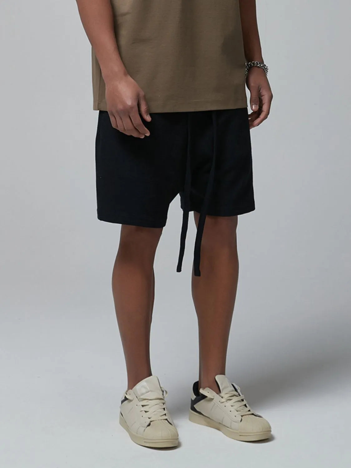 Men's dark waffle shorts with drawstring tie and side pockets, straight hem
