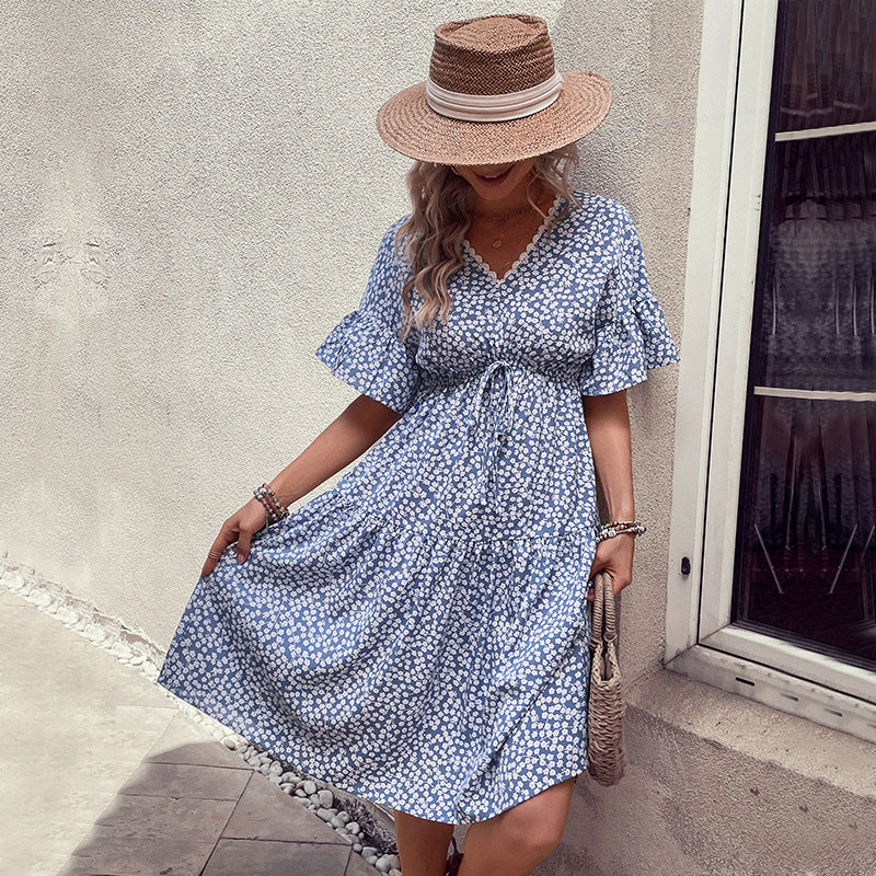 Light blue floral v-neck dress with short flounce sleeves and waist tie