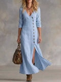 Light blue maxi dress with button front and V-neck, three-quarter sleeves, side slit