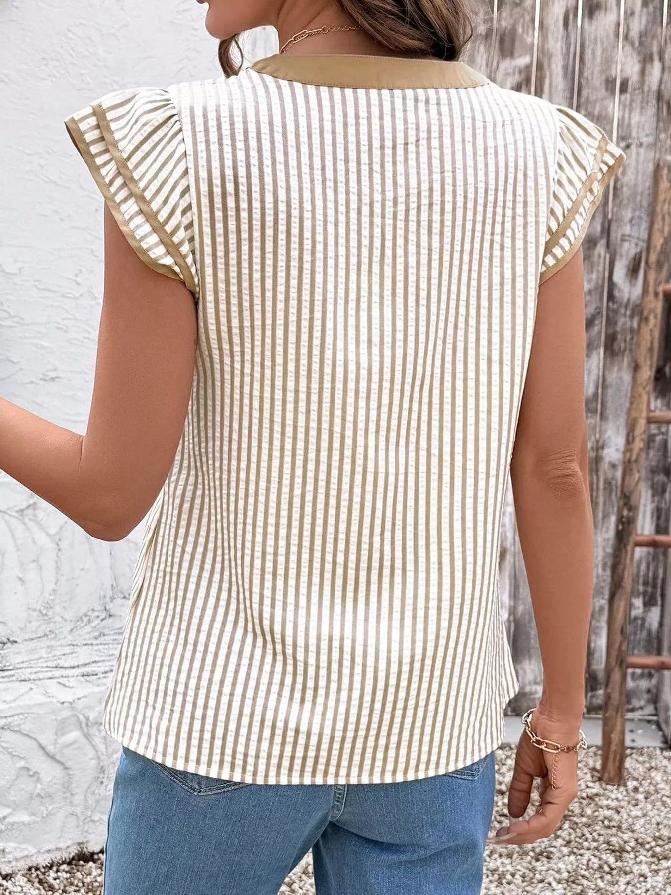 Striped ruffle-sleeve blouse in beige and white by Trendsi.