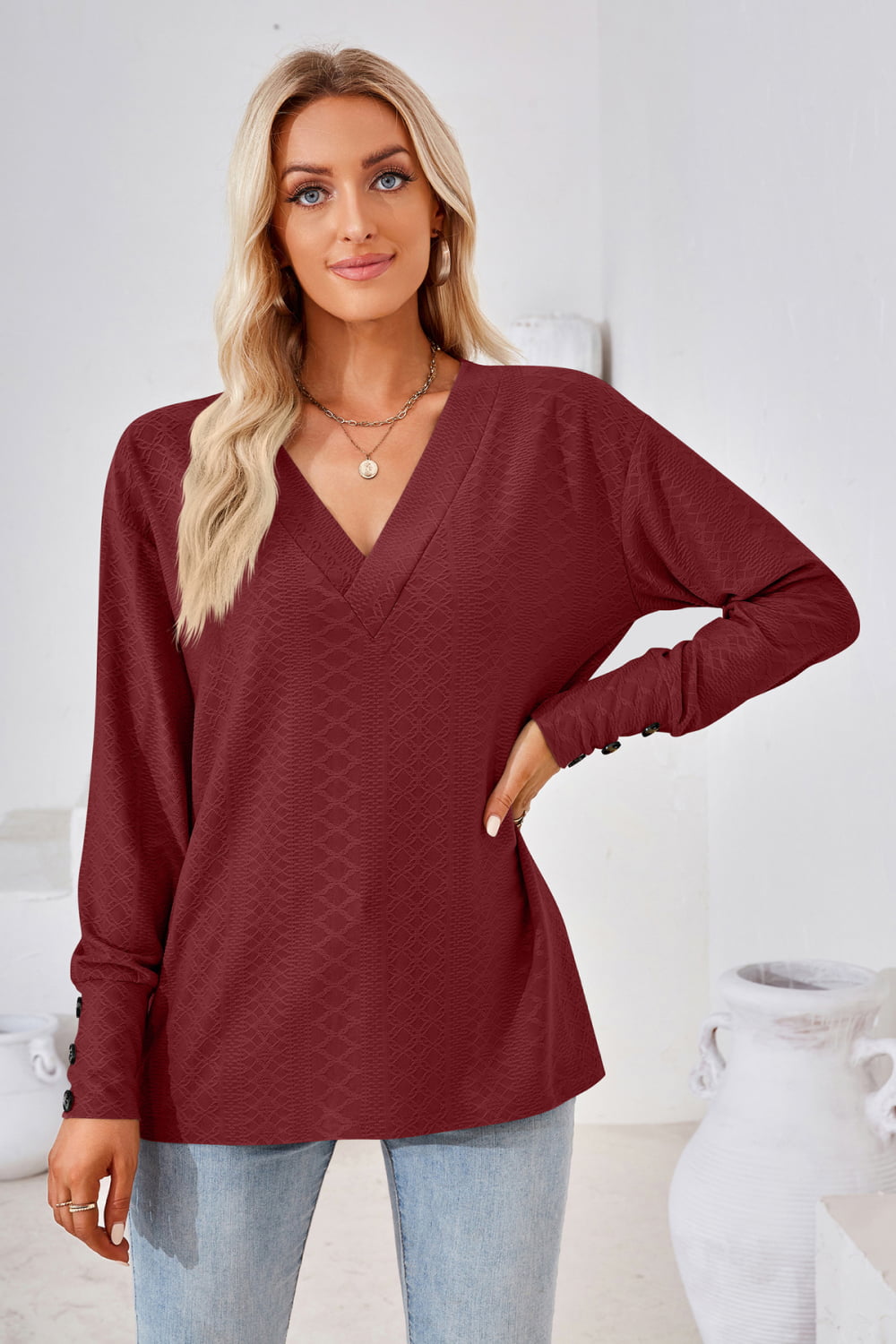 Burgundy V-neck long-sleeve blouse with relaxed fit and long sleeves