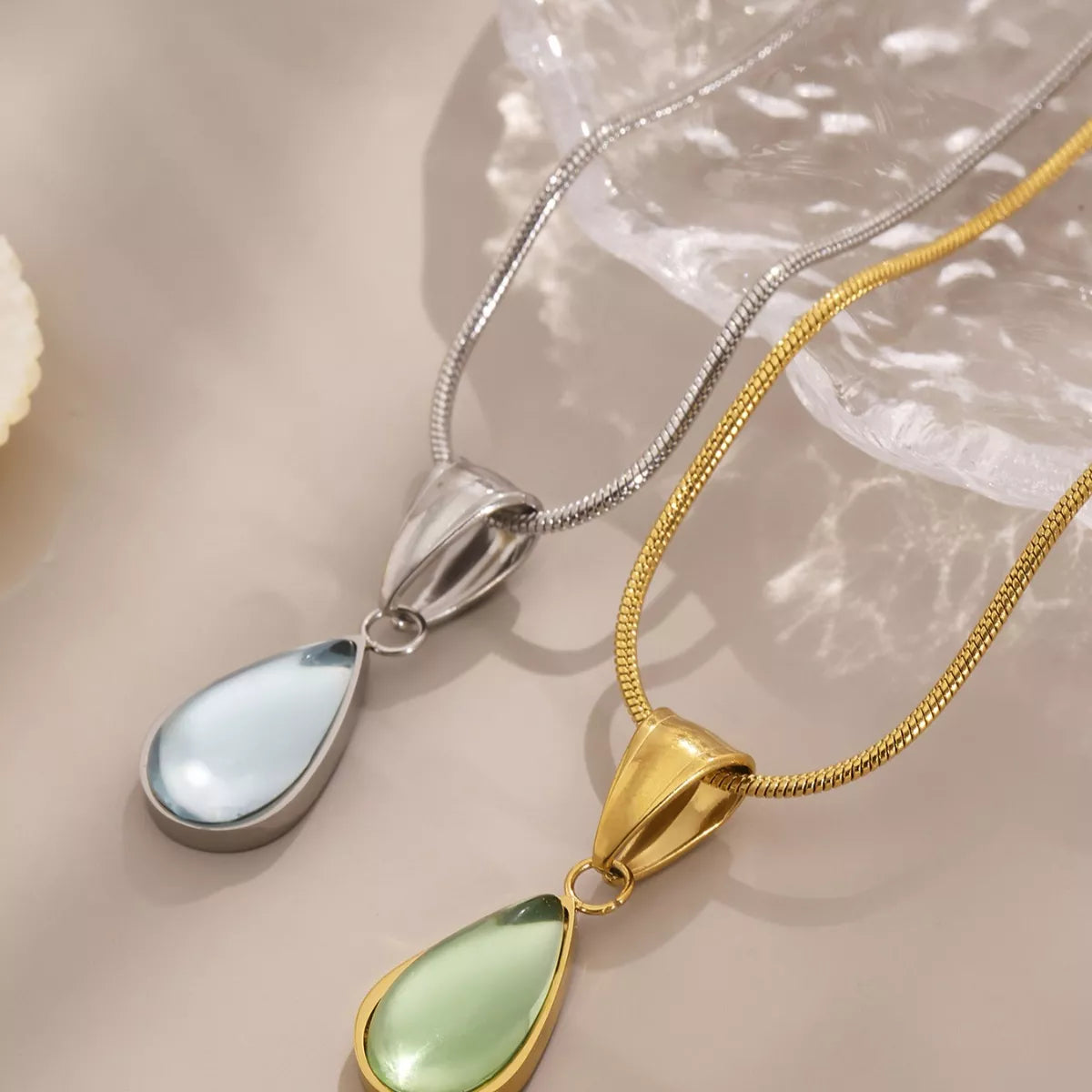 Stainless steel teardrop necklaces with green and blue glass pendants